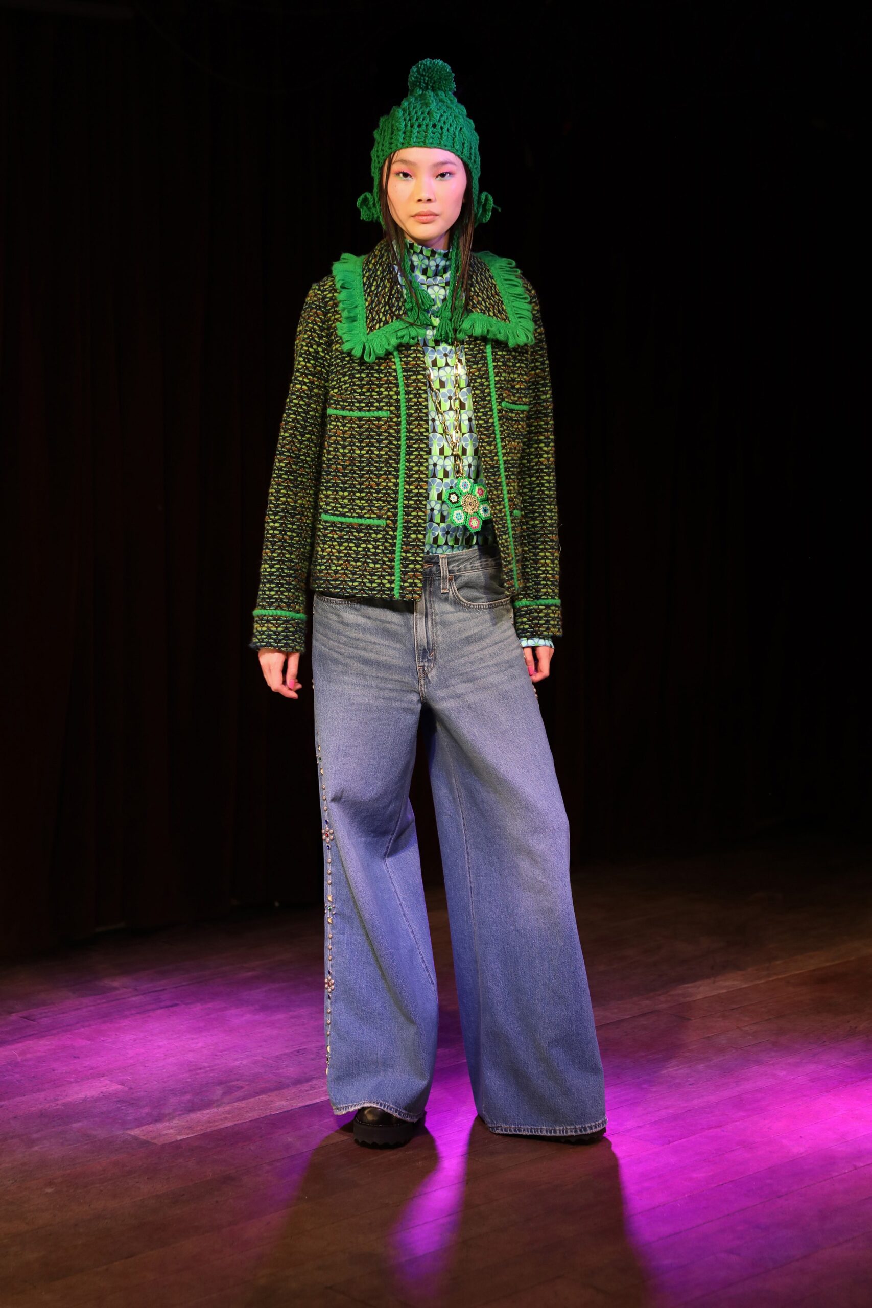 green jacket with wide-leg jeans