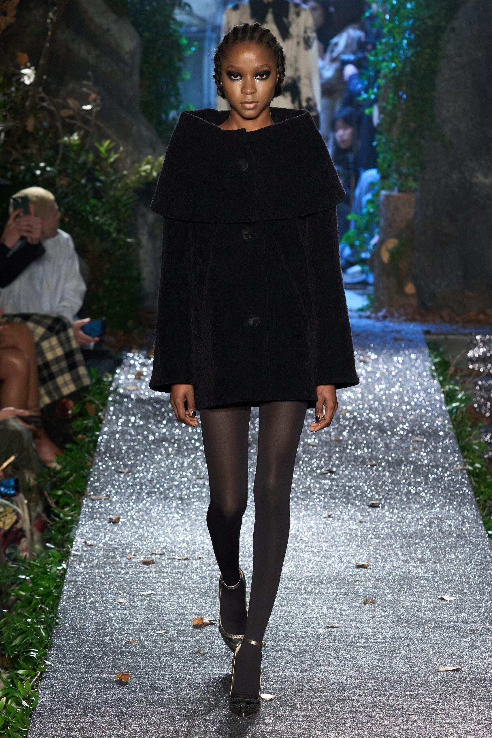 black faux-fur coat with leggings