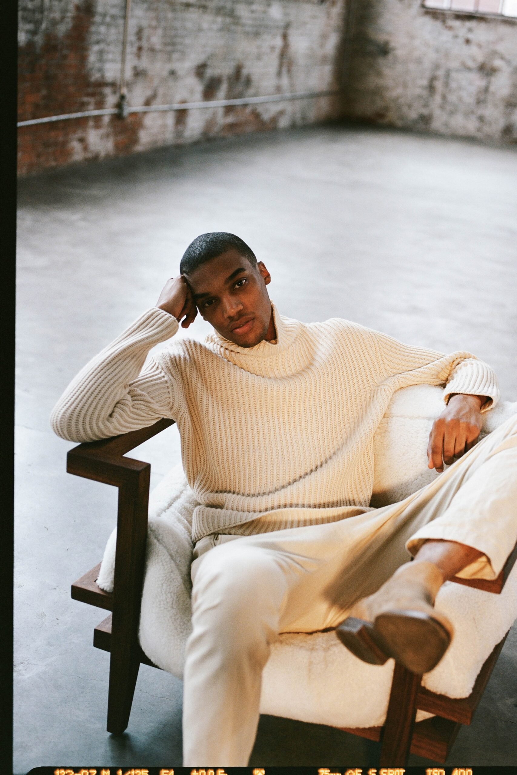 beige wool long-sleeve high-neck relaxed ribbed sweater