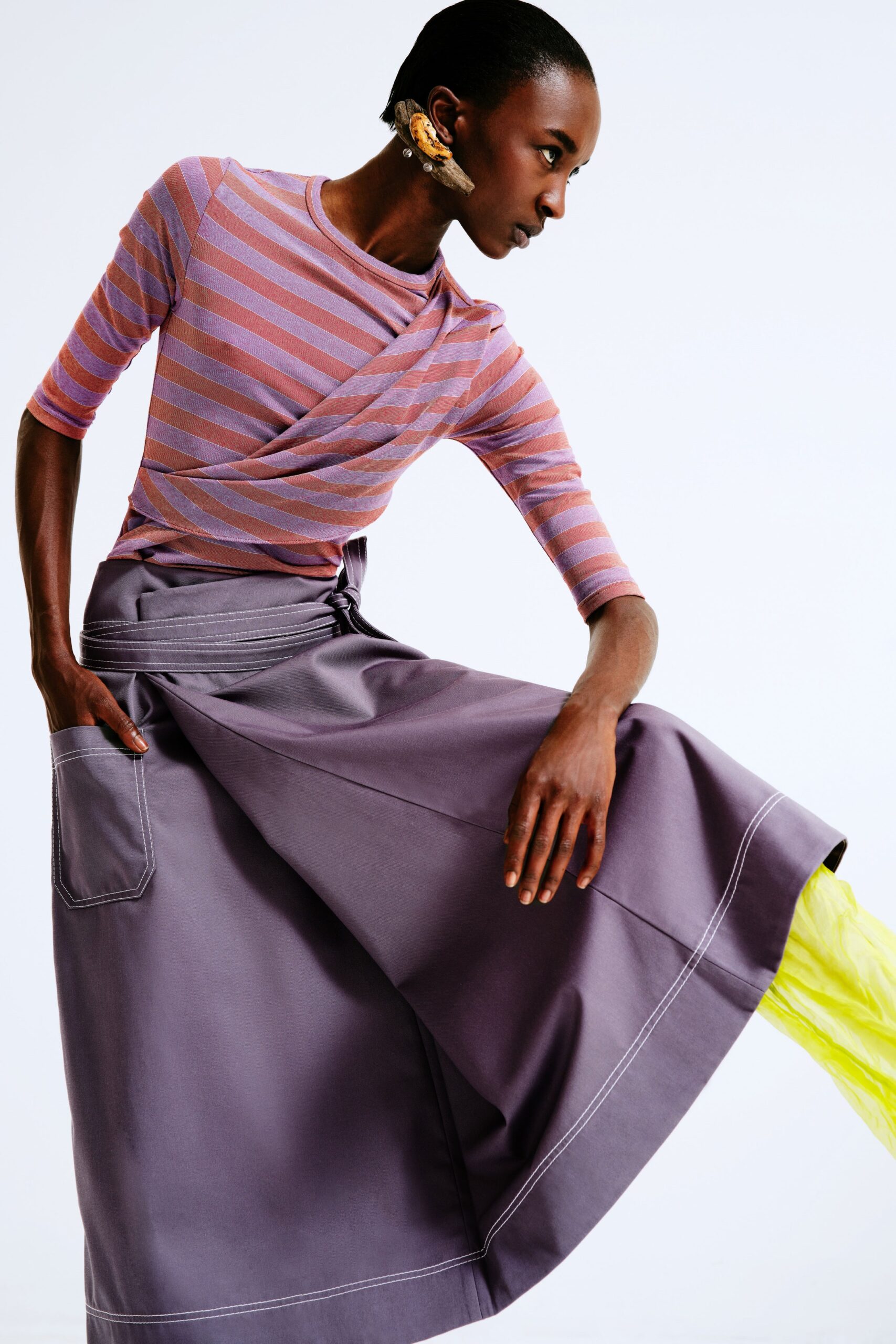 striped pink purple top and gray skirt