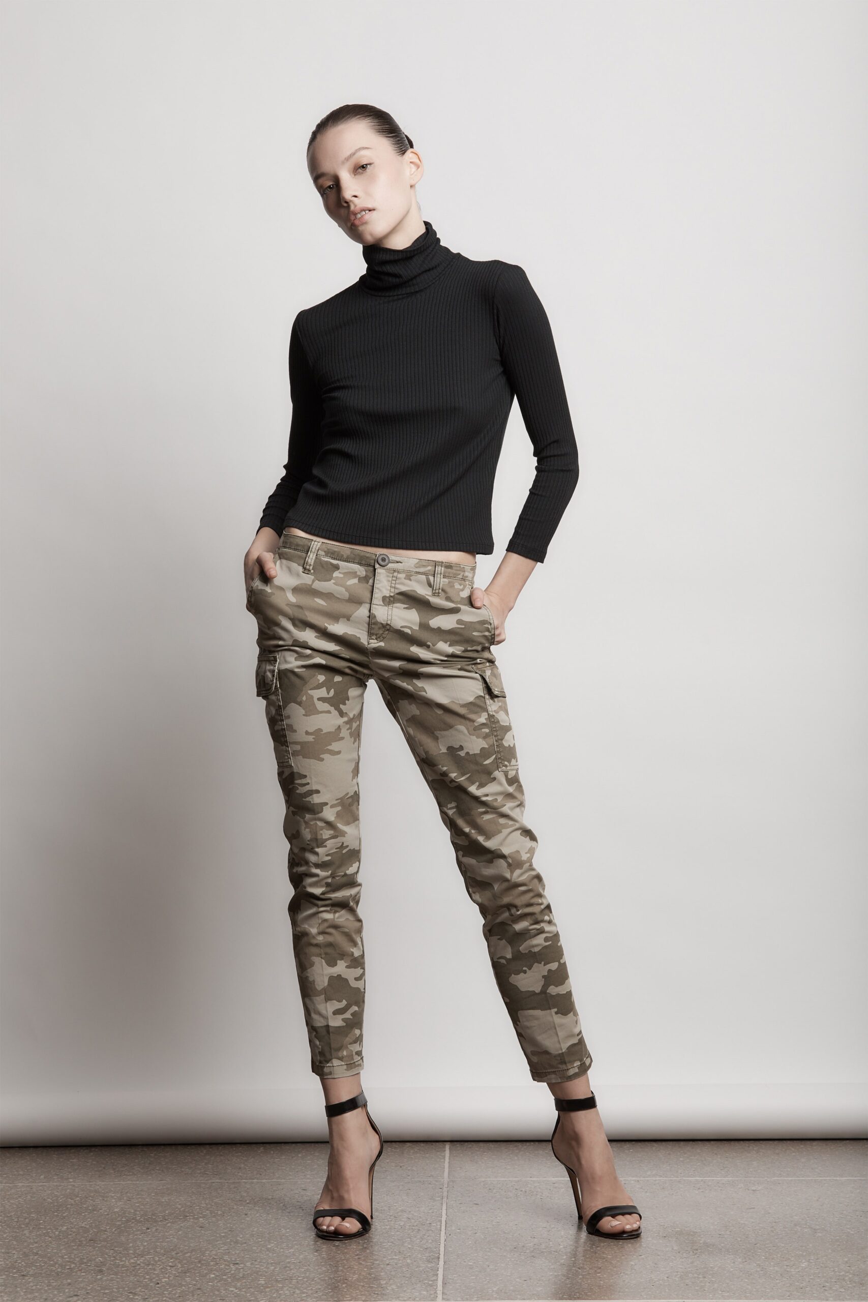 black fitted turtleneck with camo pants