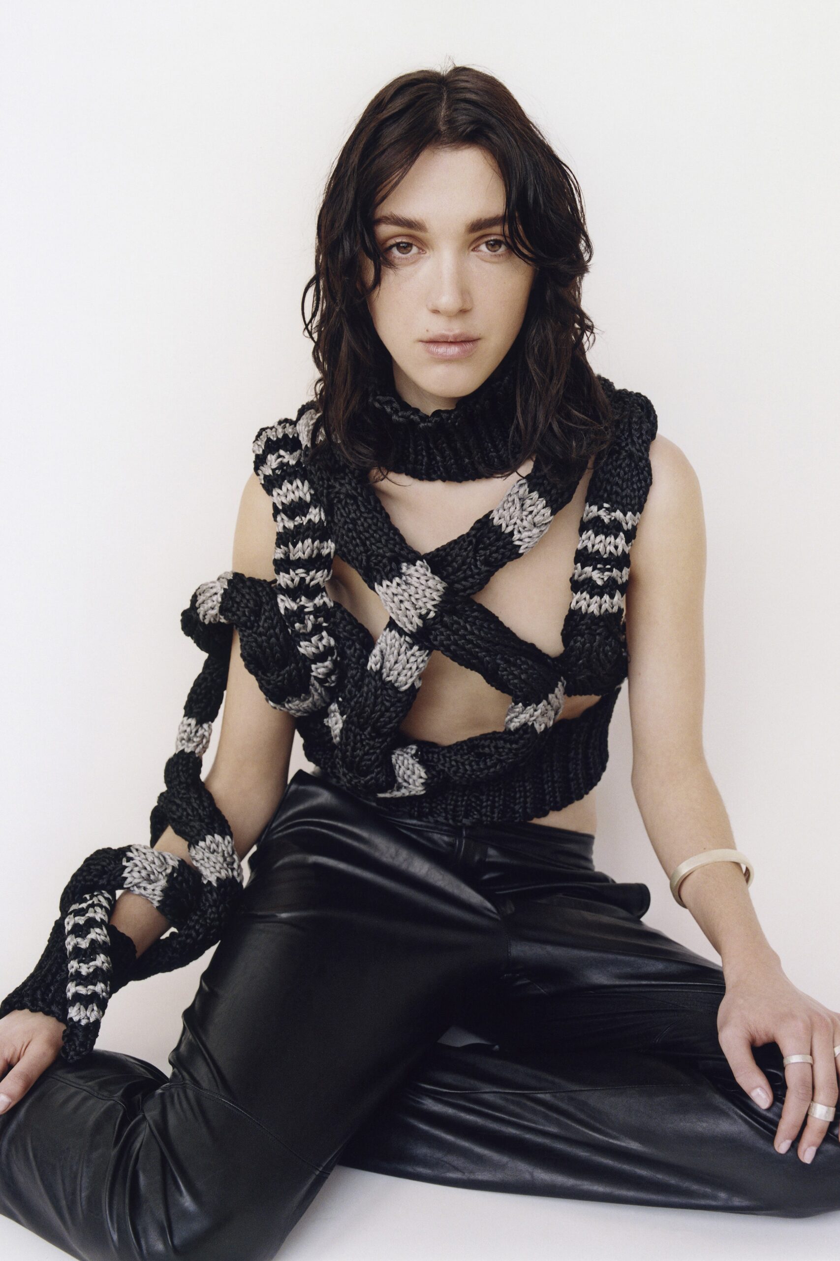 black leather fitted pants with layered top