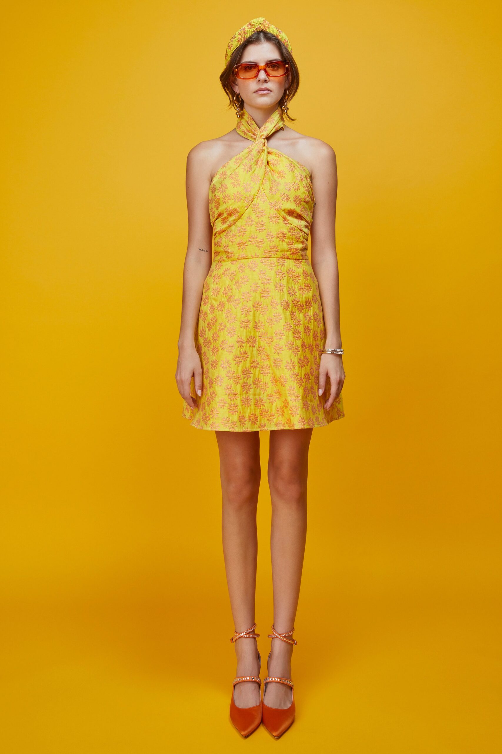 yellow floral mini dress with accessories