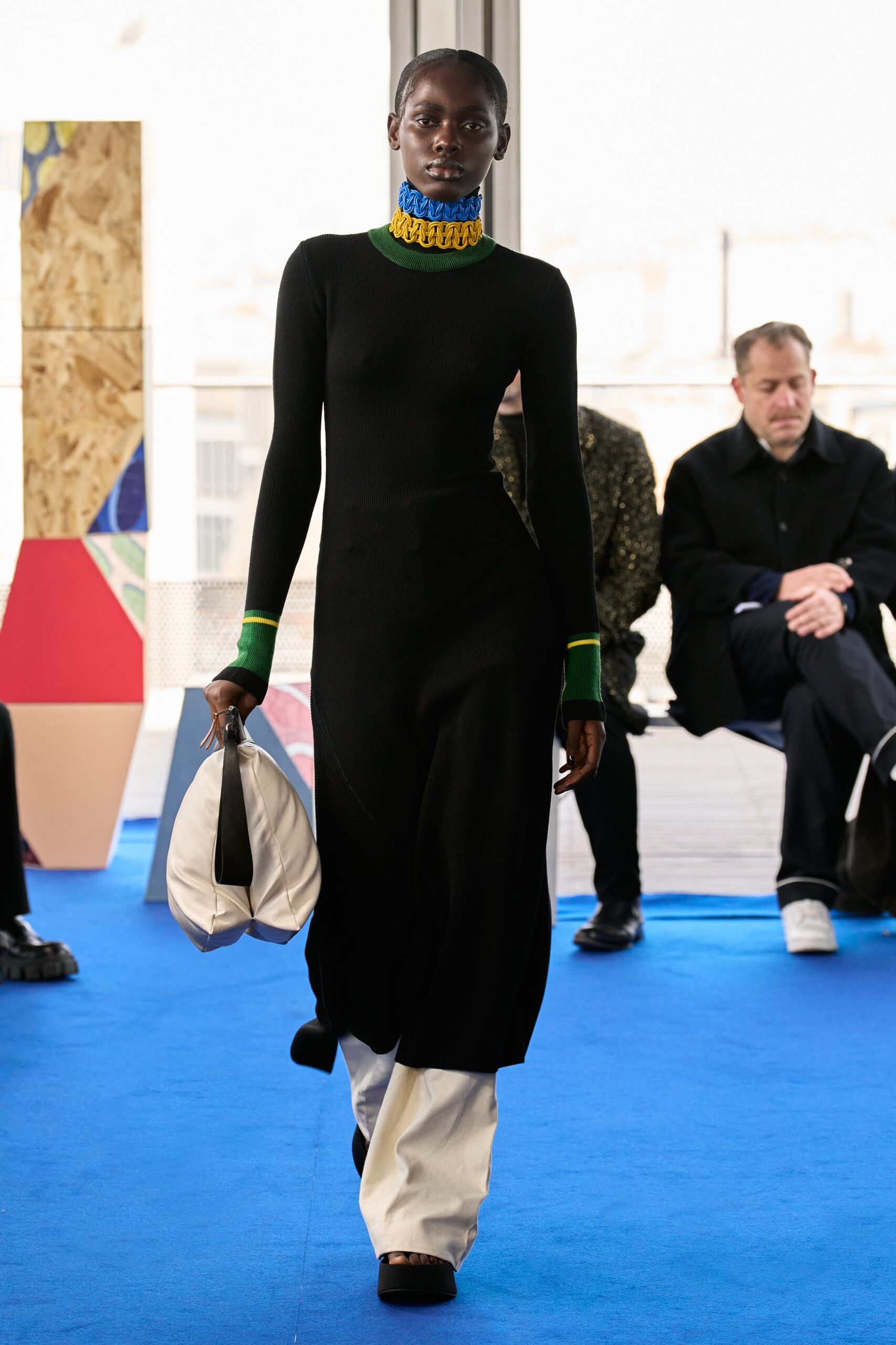 black fitted midi dress with white pants