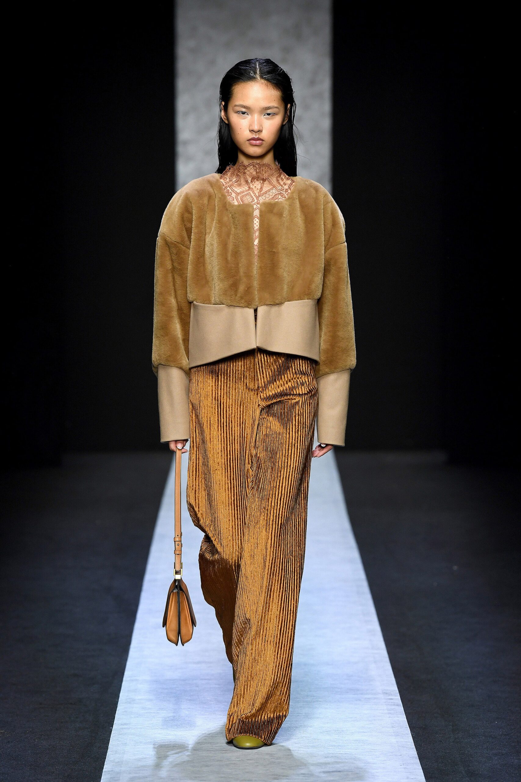 brown faux-fur jacket with orange pants