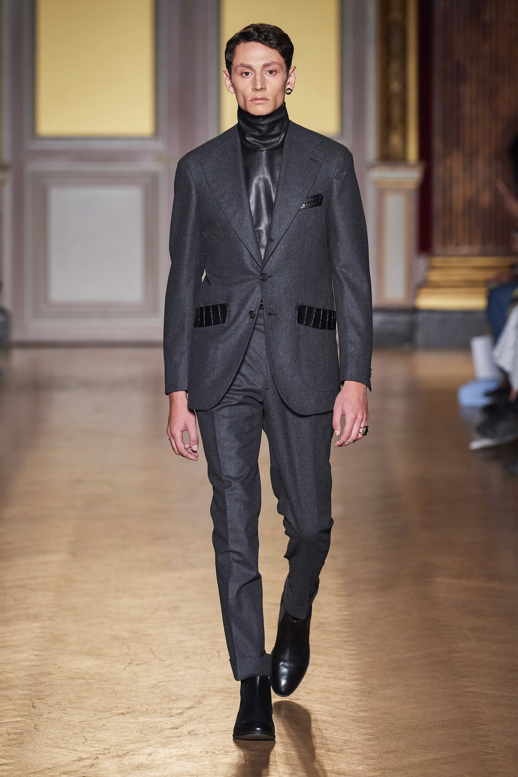 gray tailored suit with black shirt