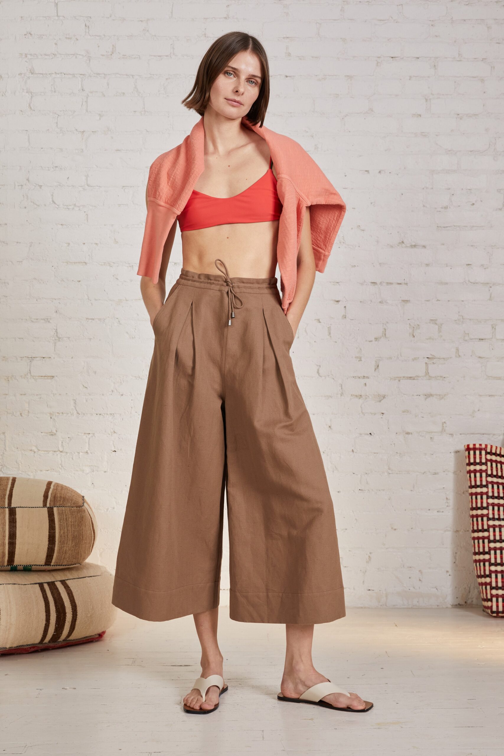 red crop-top with brown culottes