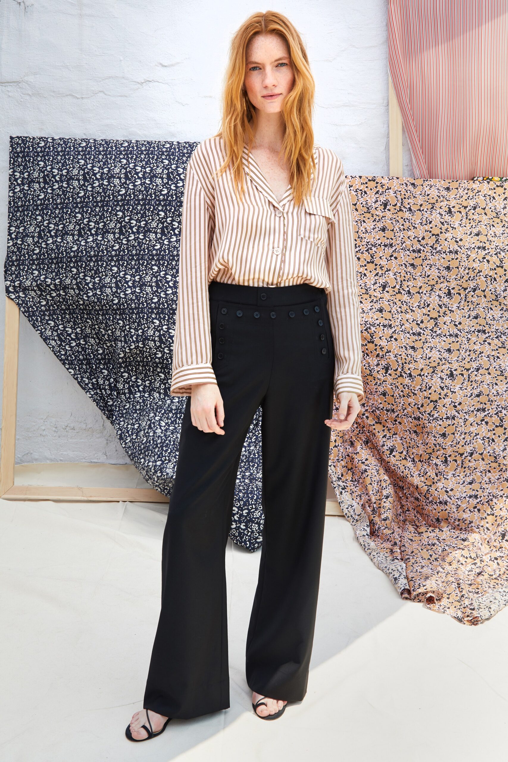 beige striped shirt with black pants