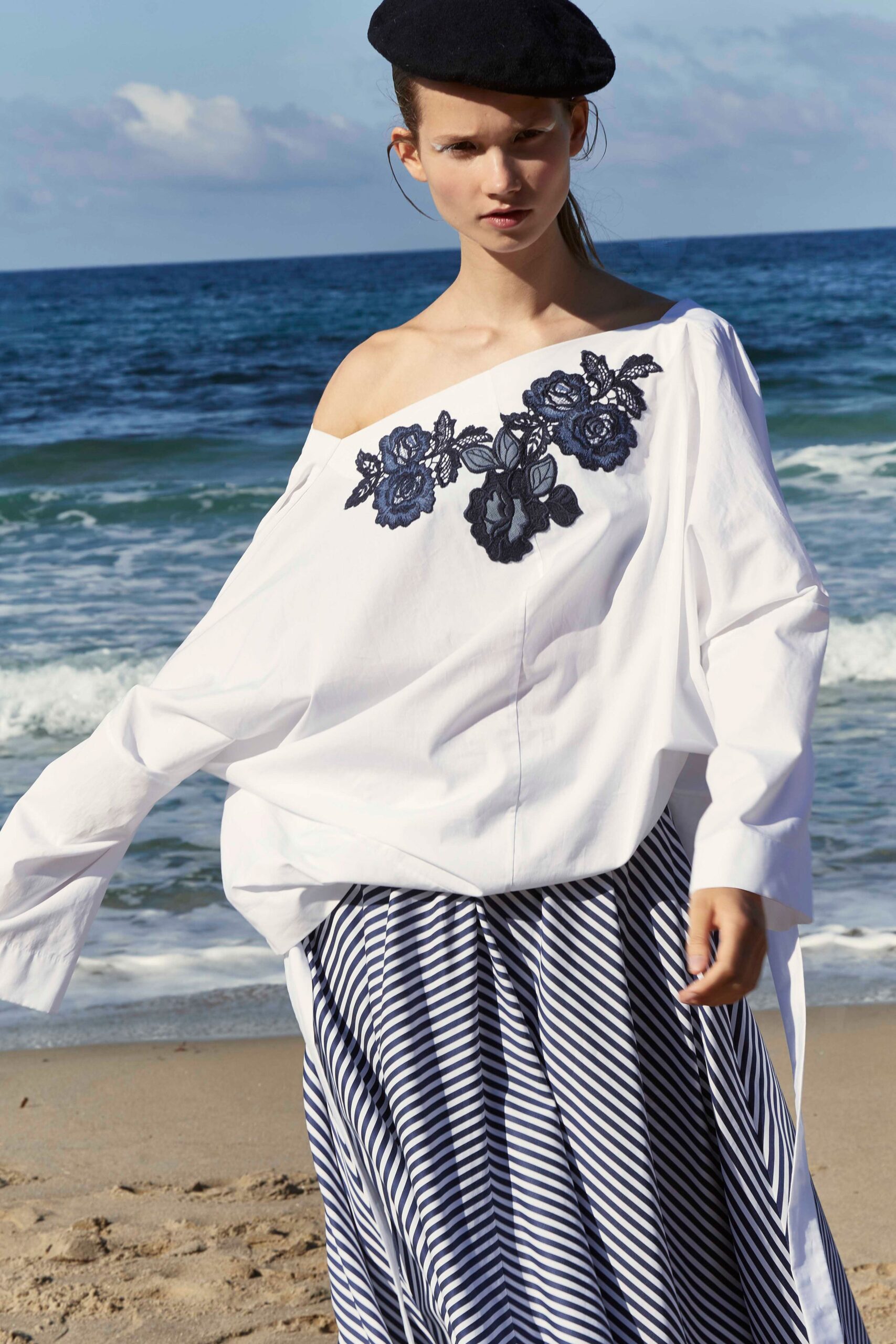 white off-shoulder blouse with blue striped skirt