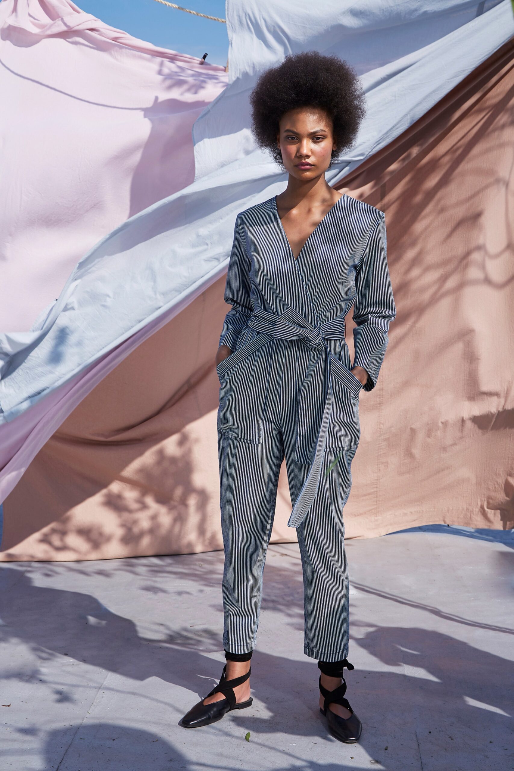 blue and white belted jumpsuit