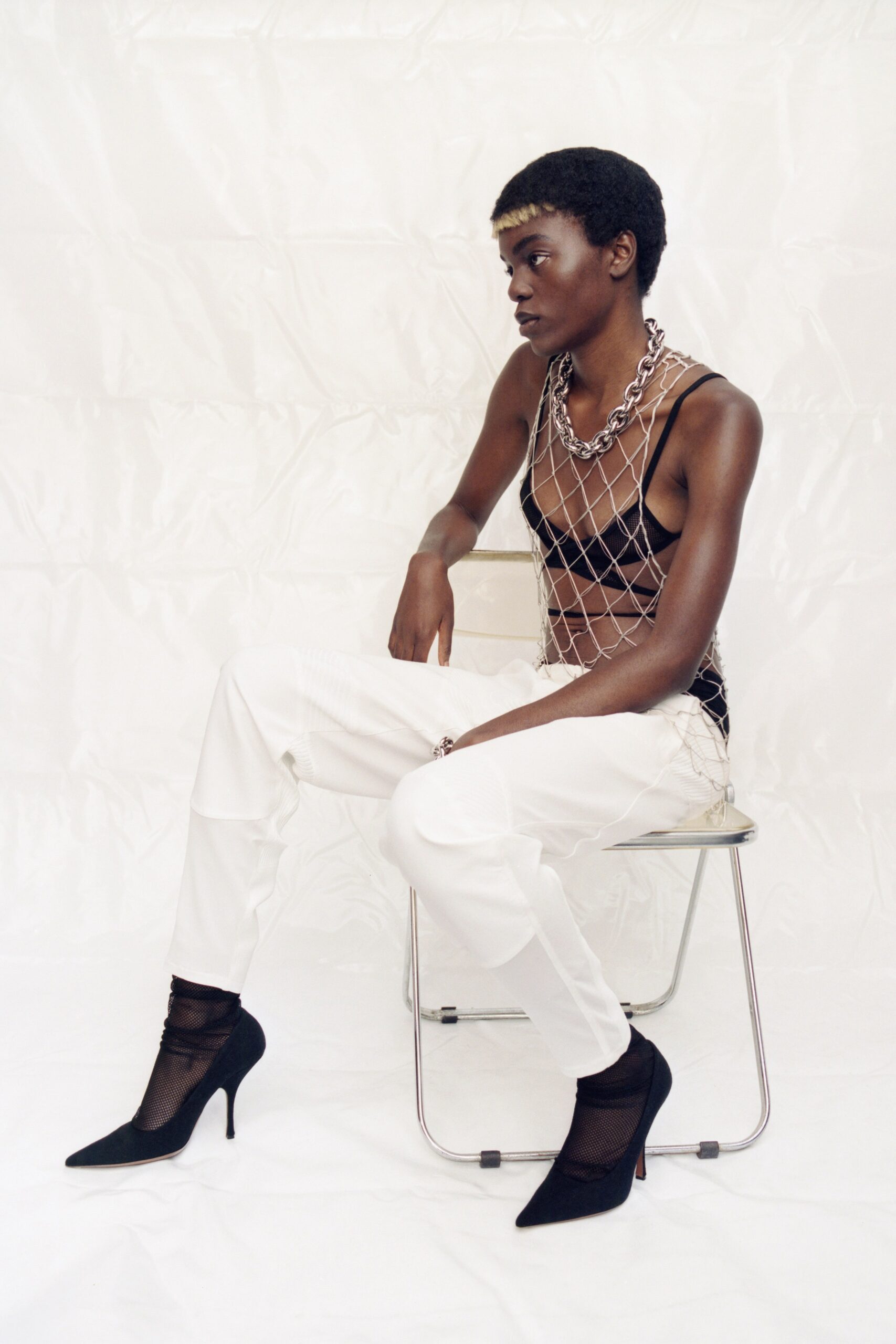 black fitted top white slim pants