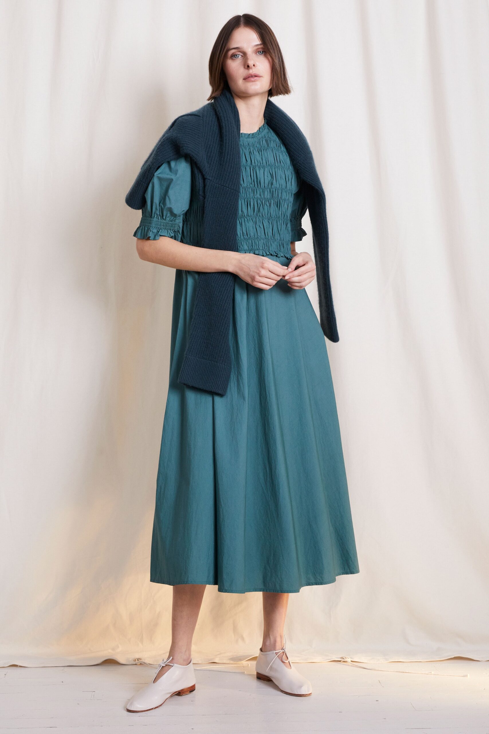 teal midi dress with navy sweater