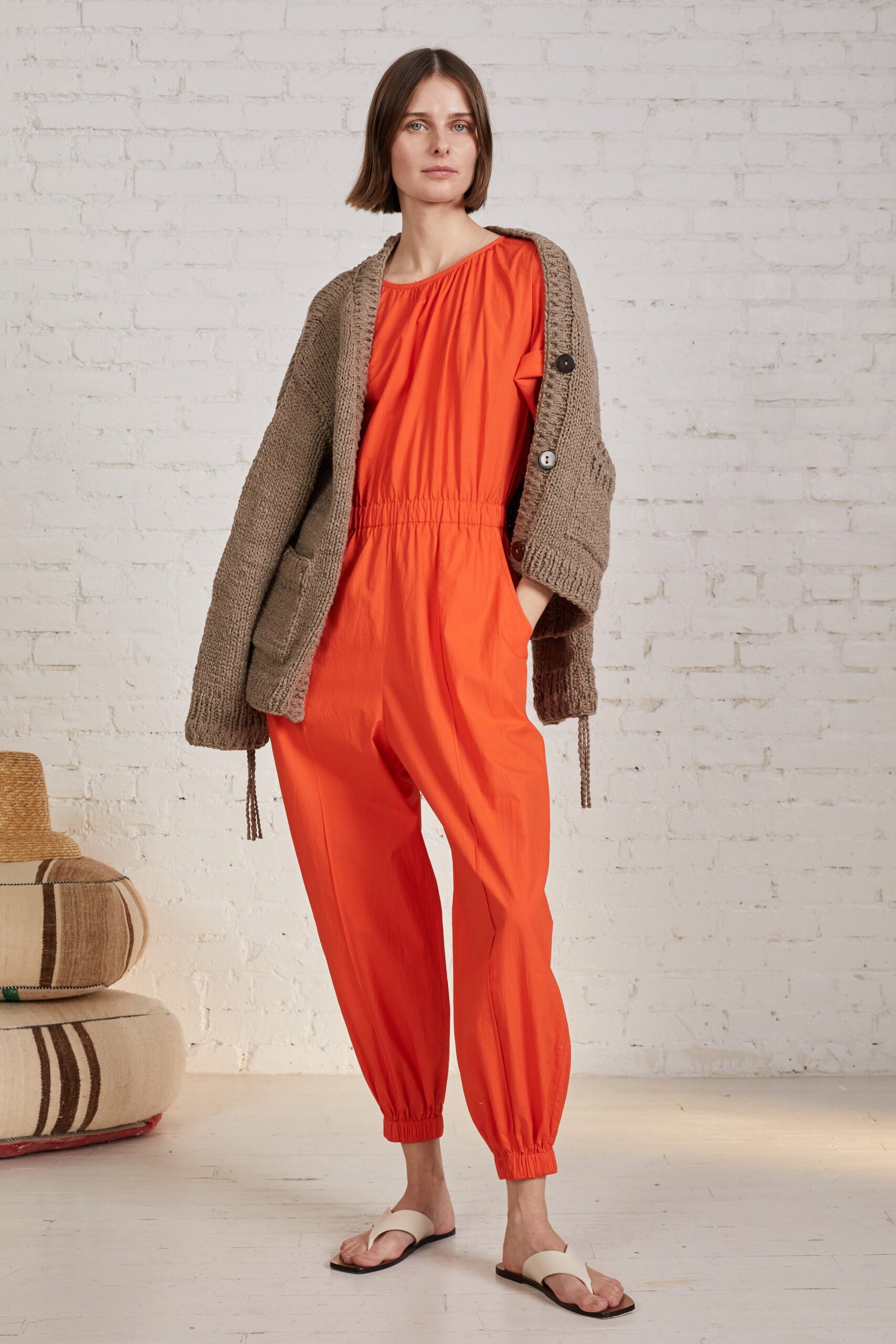 orange cotton sleeveless high-neck relaxed zippered jumpsuit
