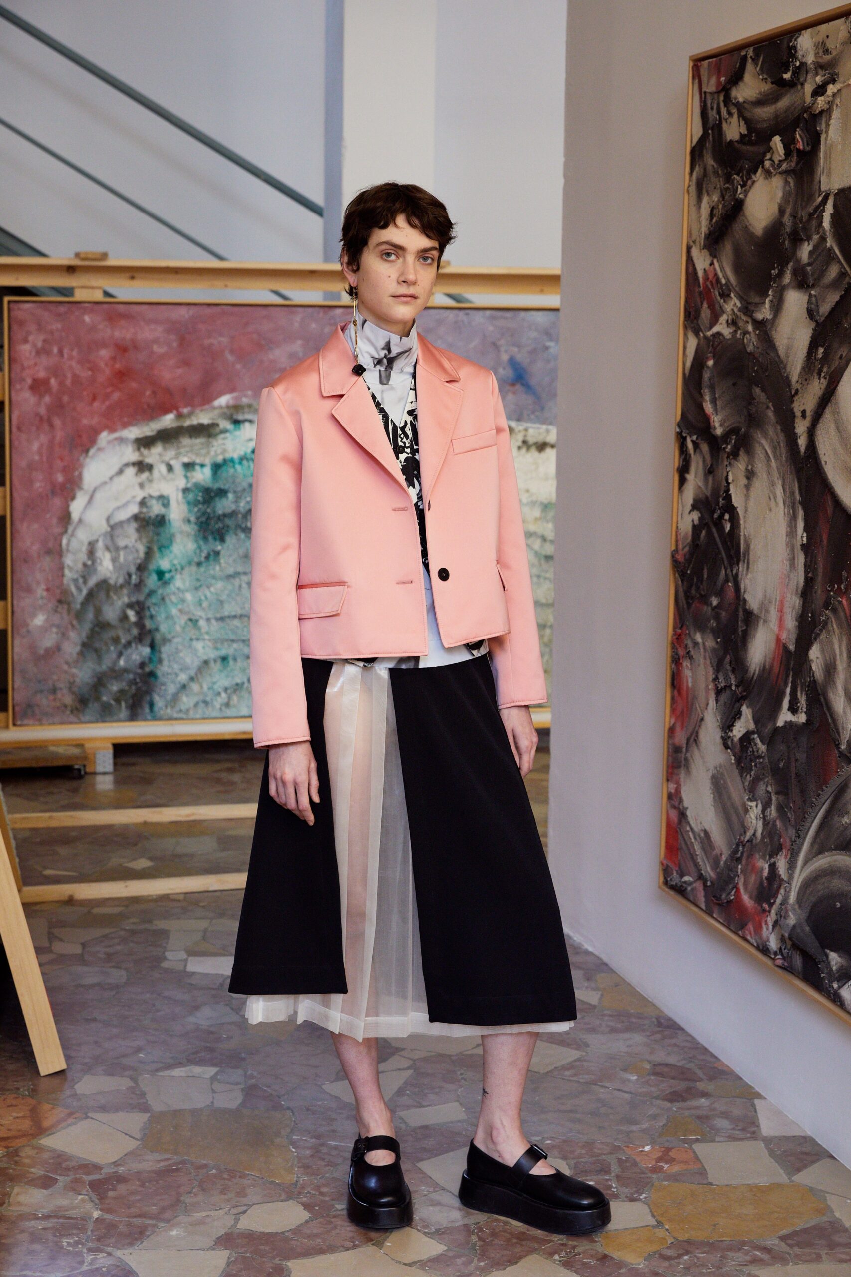 pink tailored jacket with black skirt