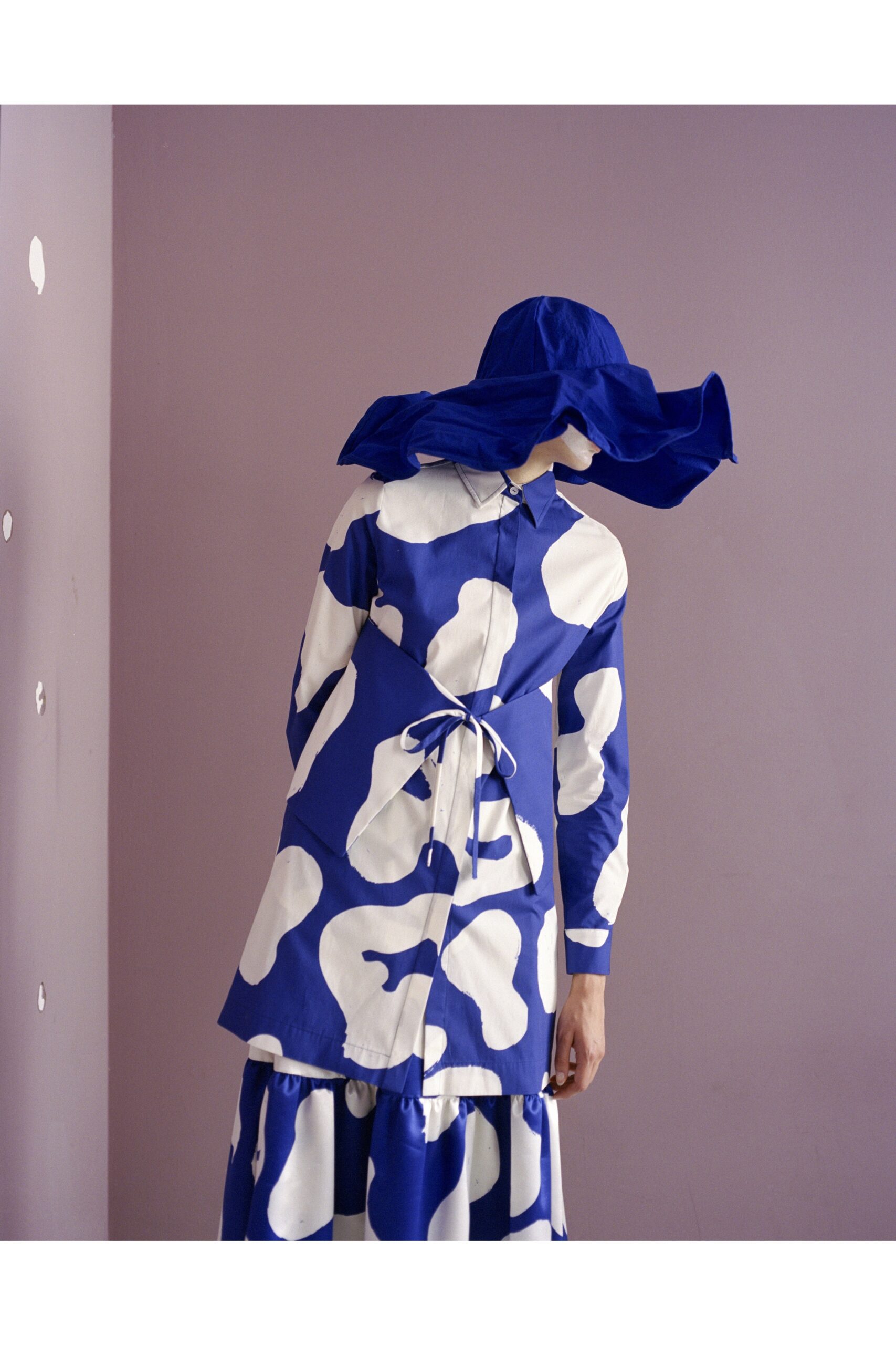 blue and white tiered dress with hat