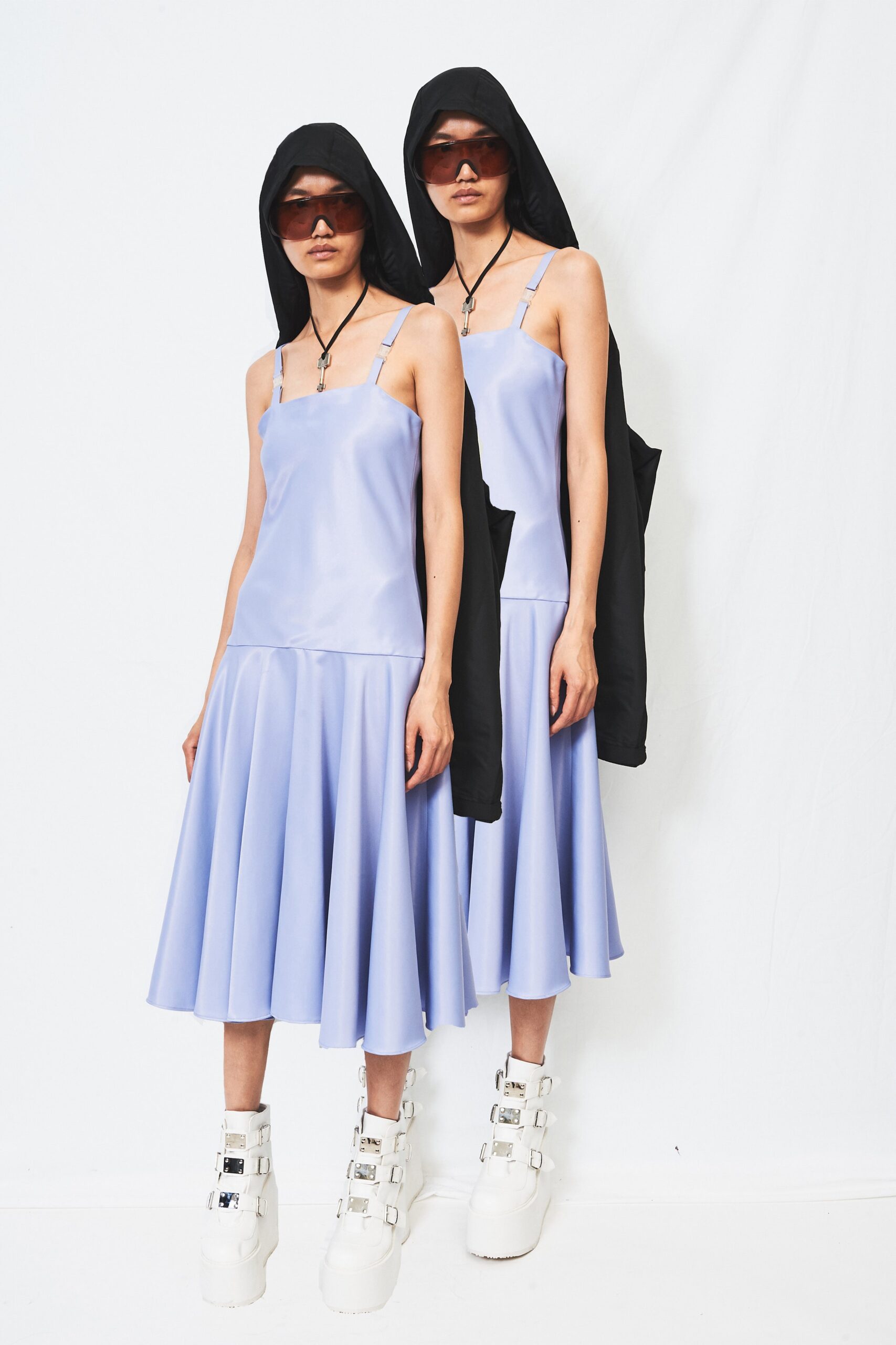 lavender pleated midi dress with oversized black coat