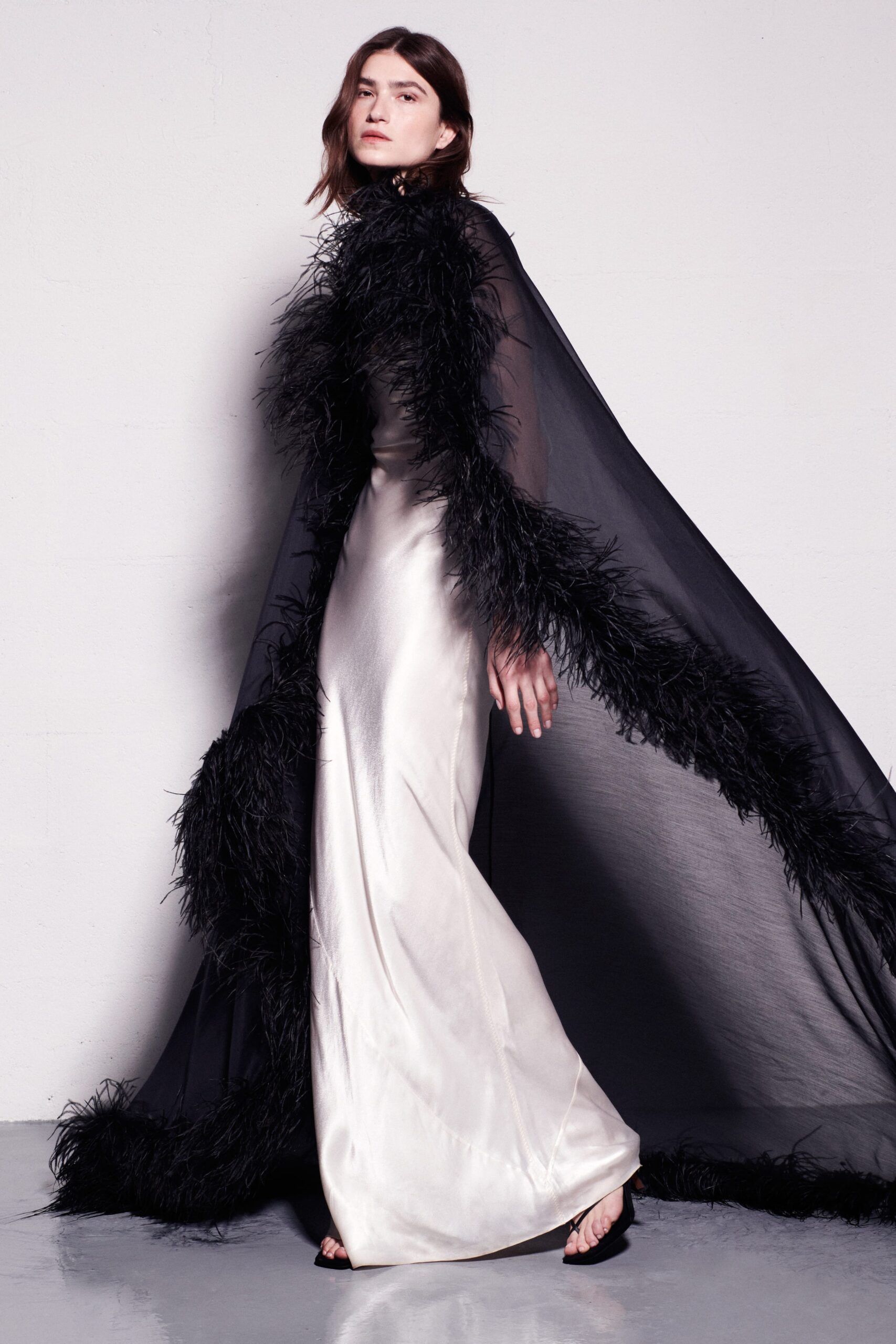 black feathered cape and gown