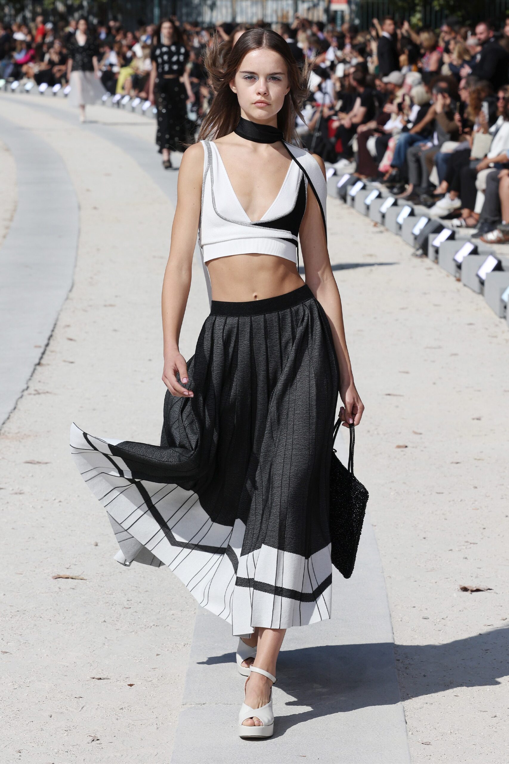 black and white color-blocked top with pleated skirt