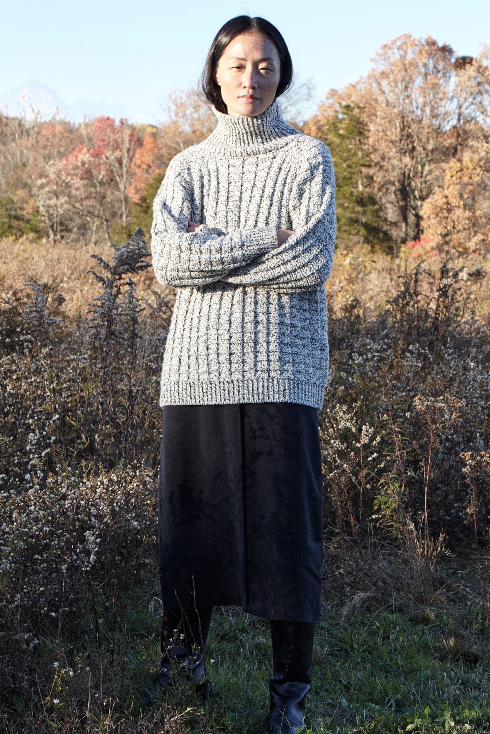 gray oversized sweater and black midi skirt