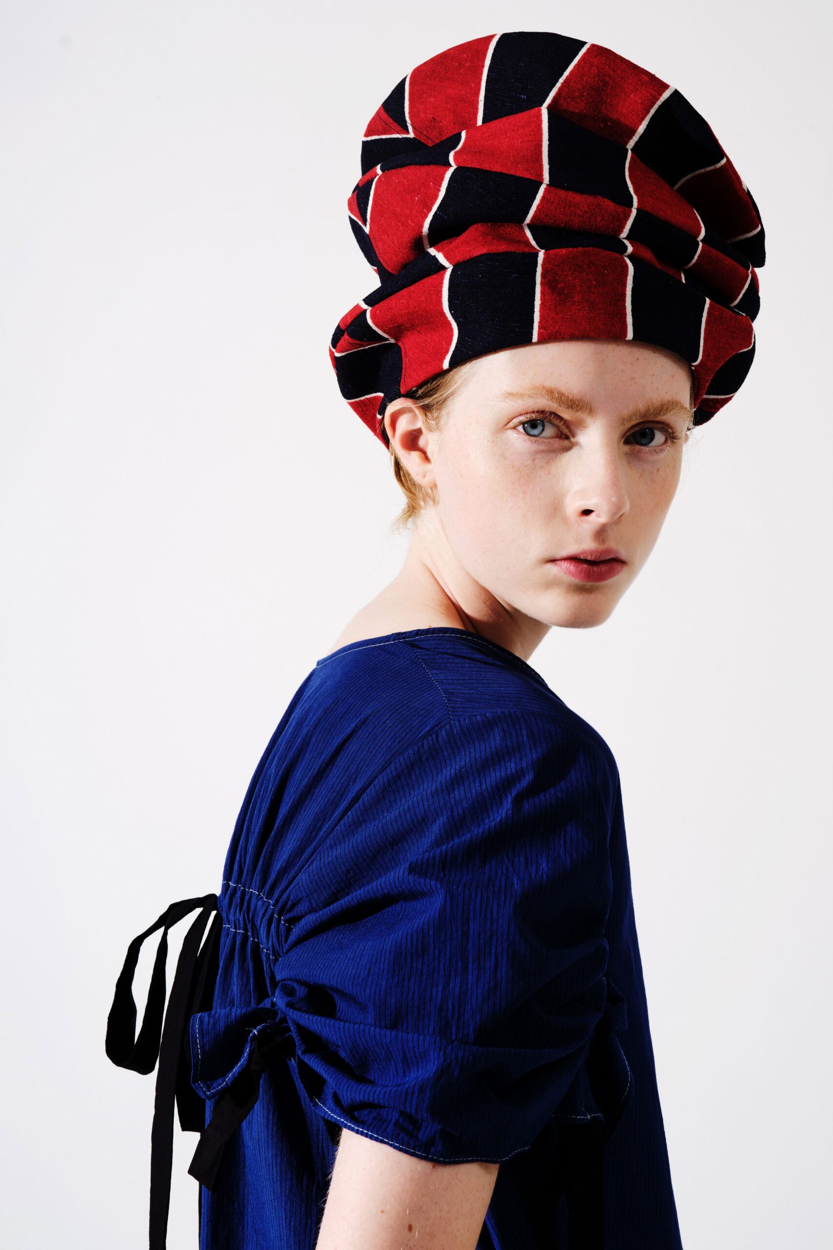 blue relaxed top with structured hat