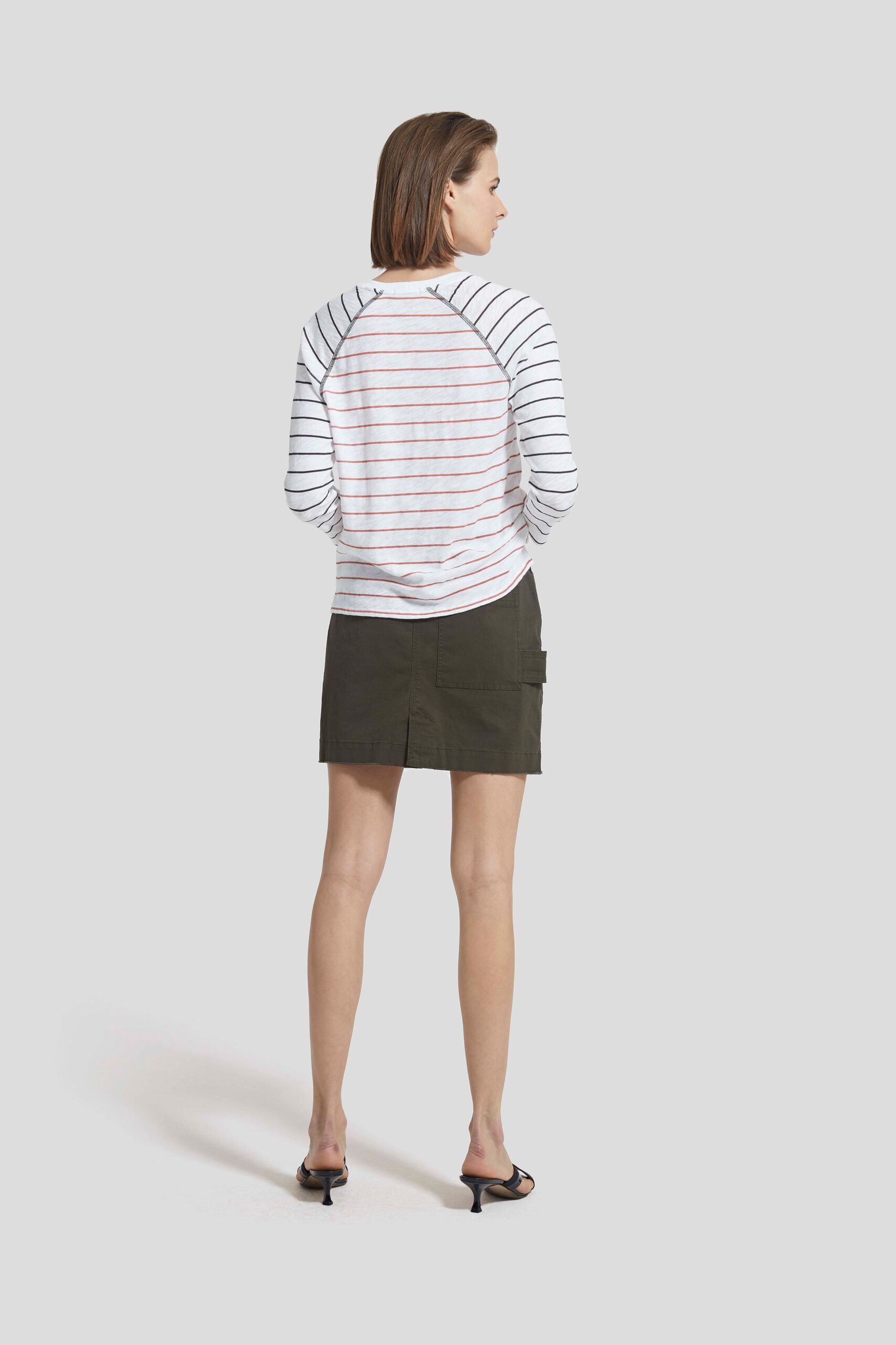 striped top and green skirt