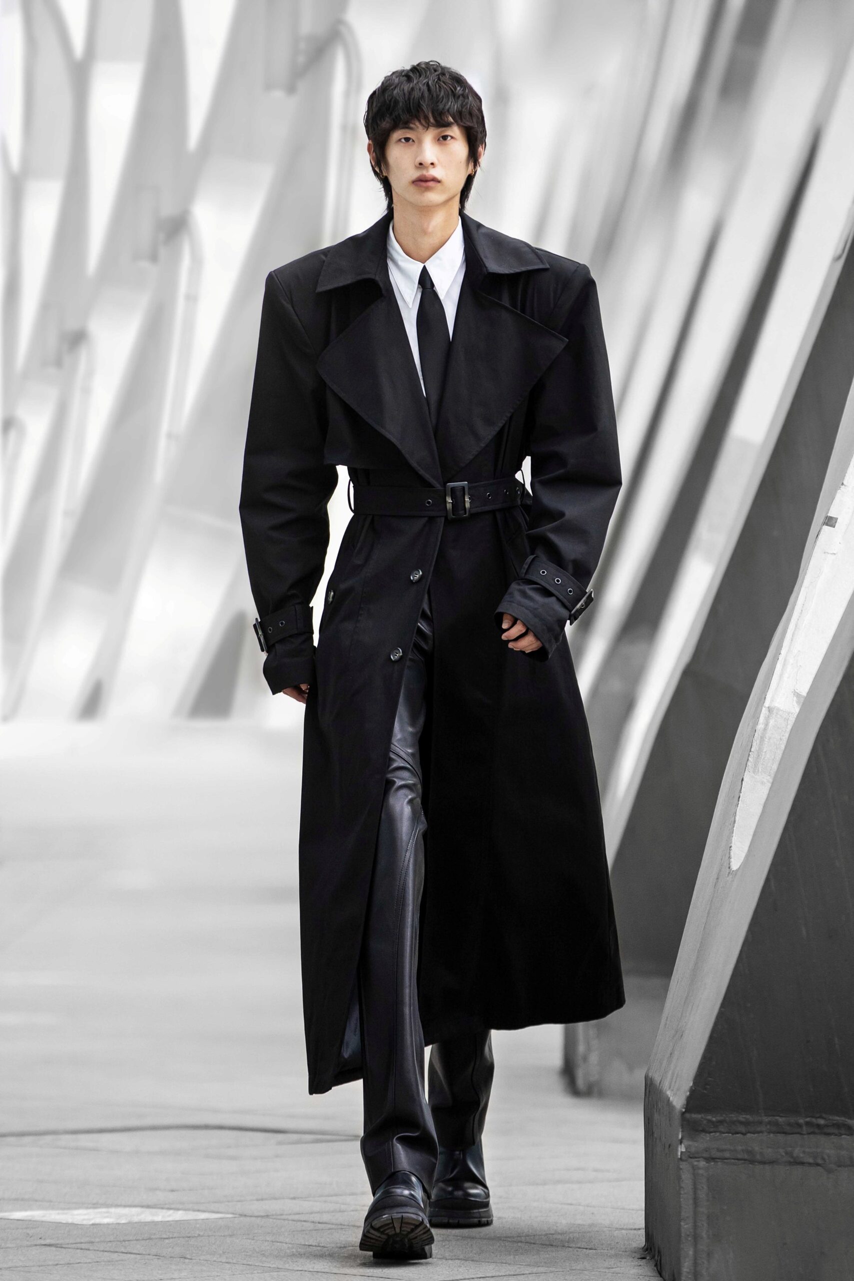 black oversized trench coat and leather pants