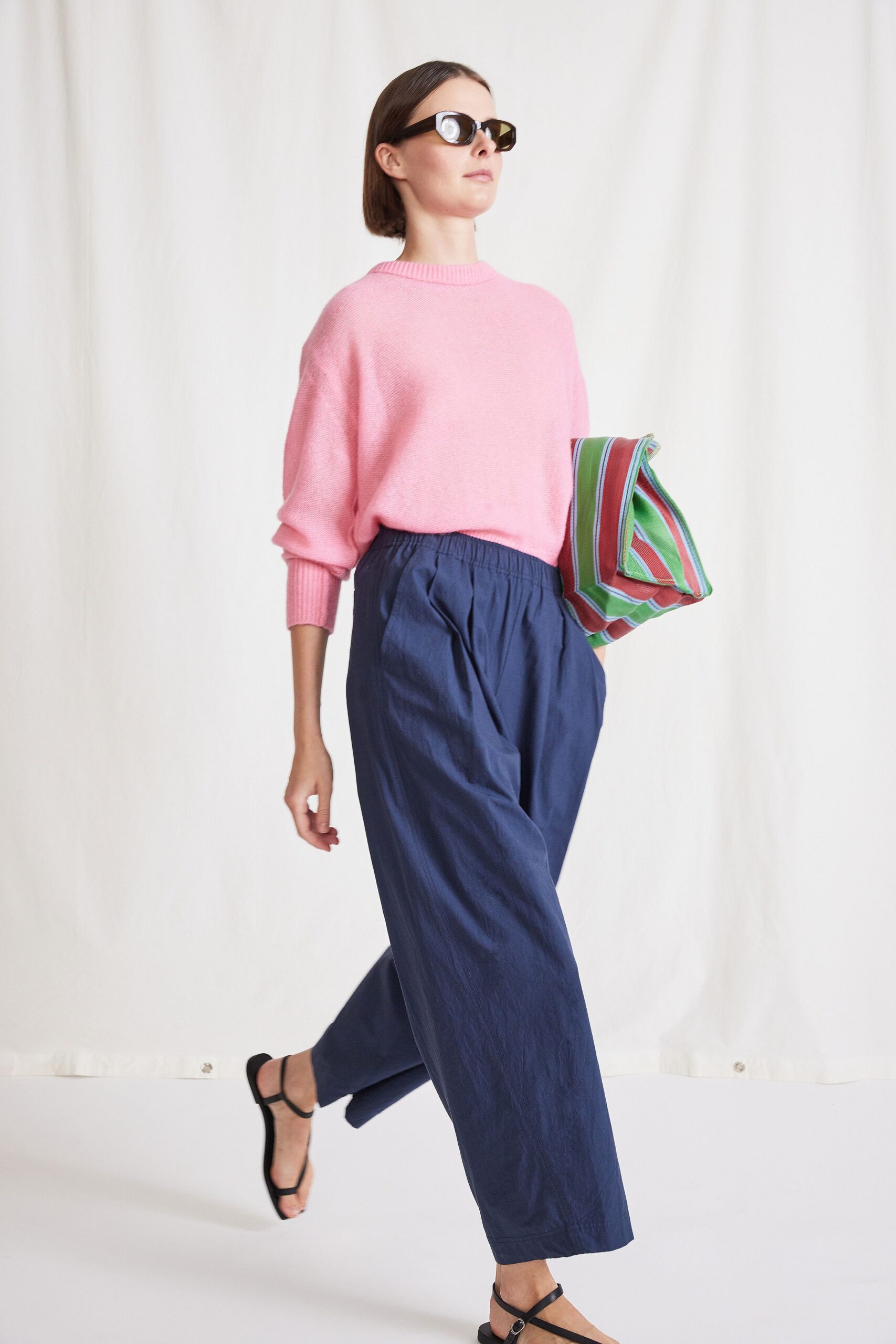 pink wool relaxed sweater with blue pants