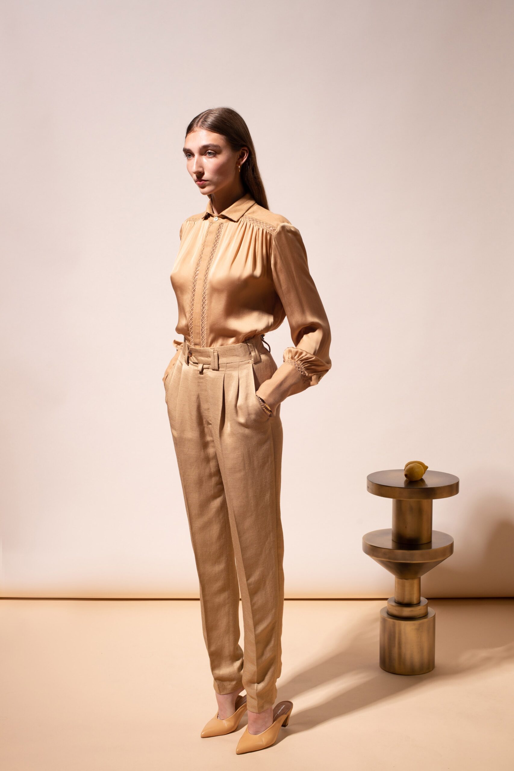 beige silk blouse and tailored pants