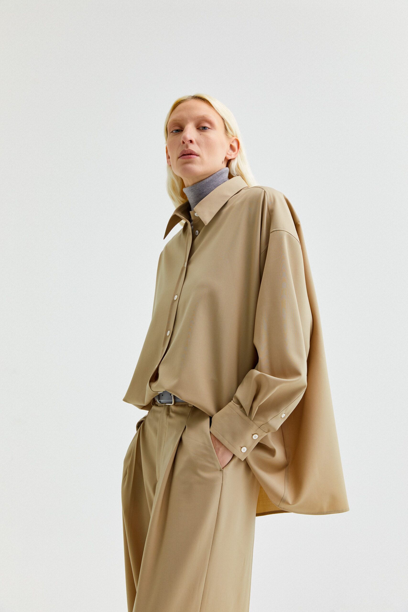 beige oversized shirt and relaxed pants