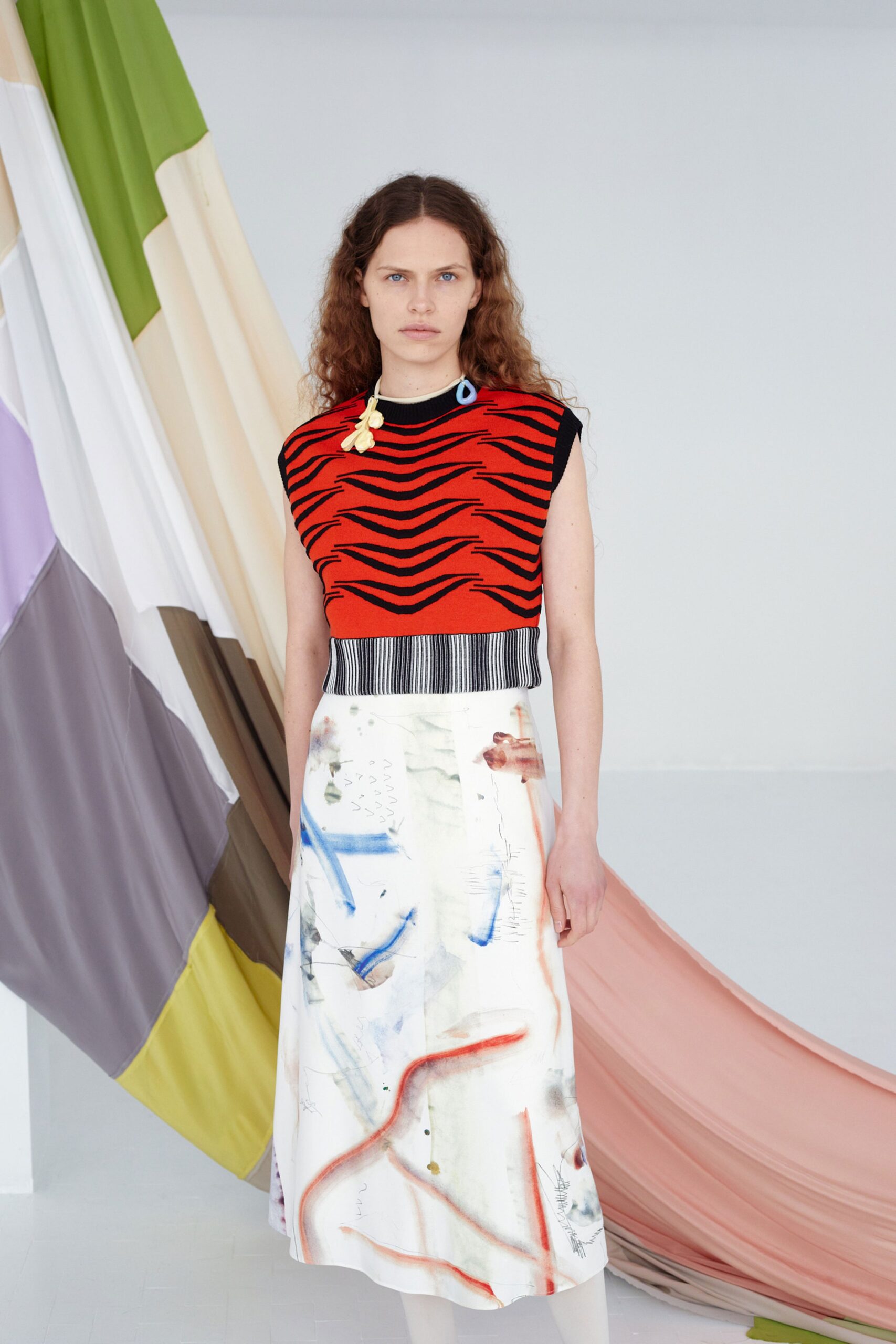 red black printed top and white skirt