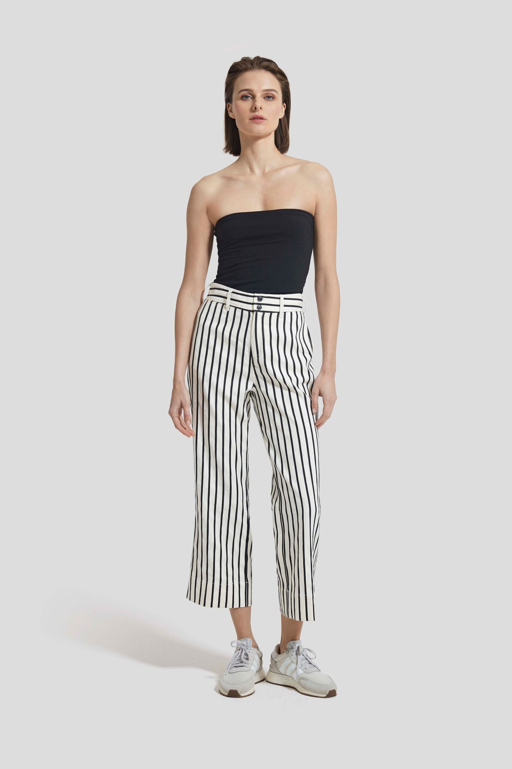 black strapless top with striped pants