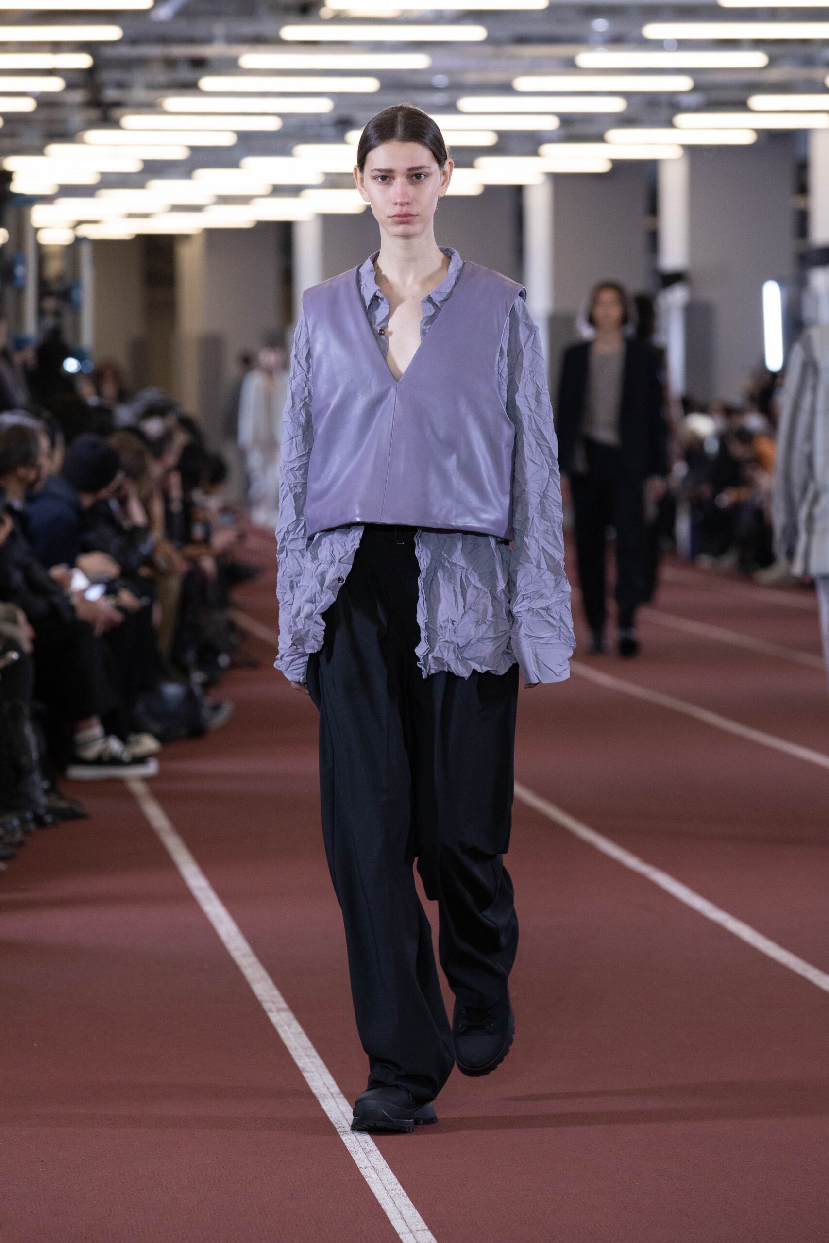 purple ruffled top with black pants