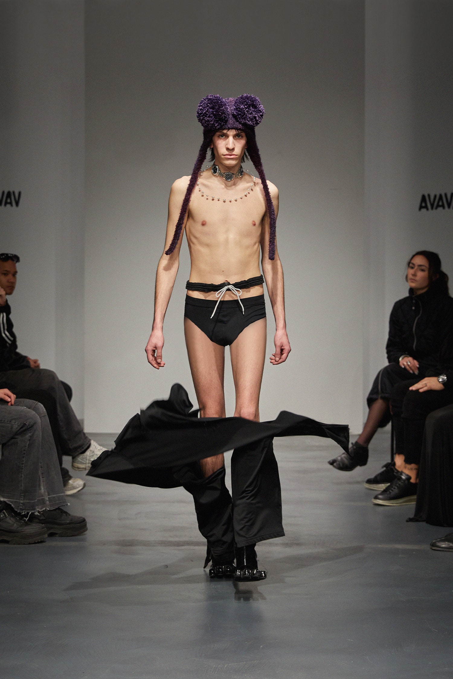 black fitted pants with purple hat