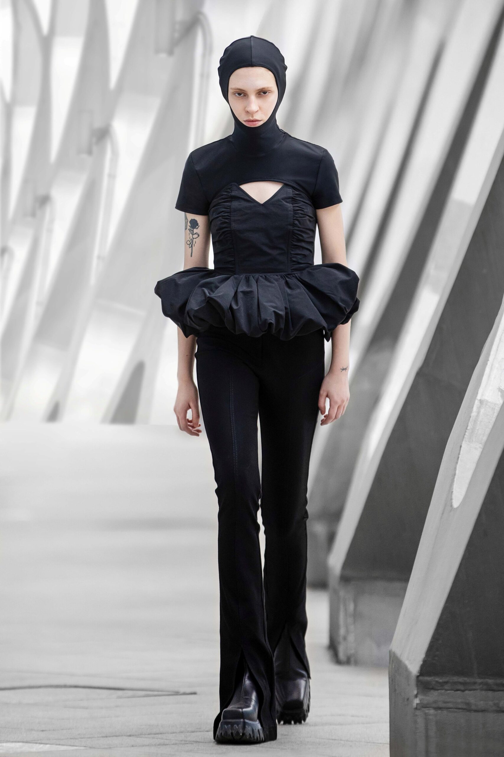 black fitted top and flared pants