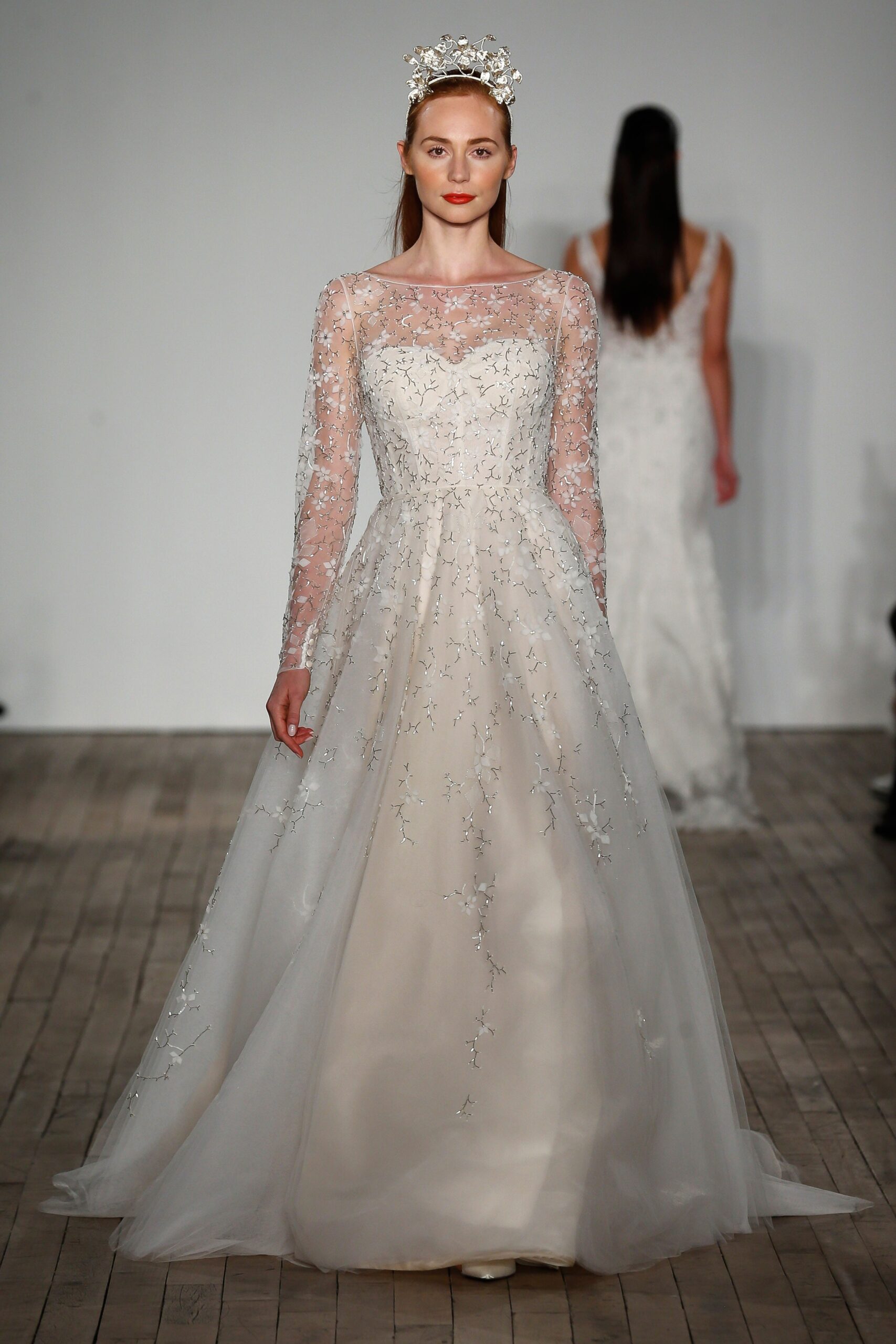 white embroidered long-sleeve gown
