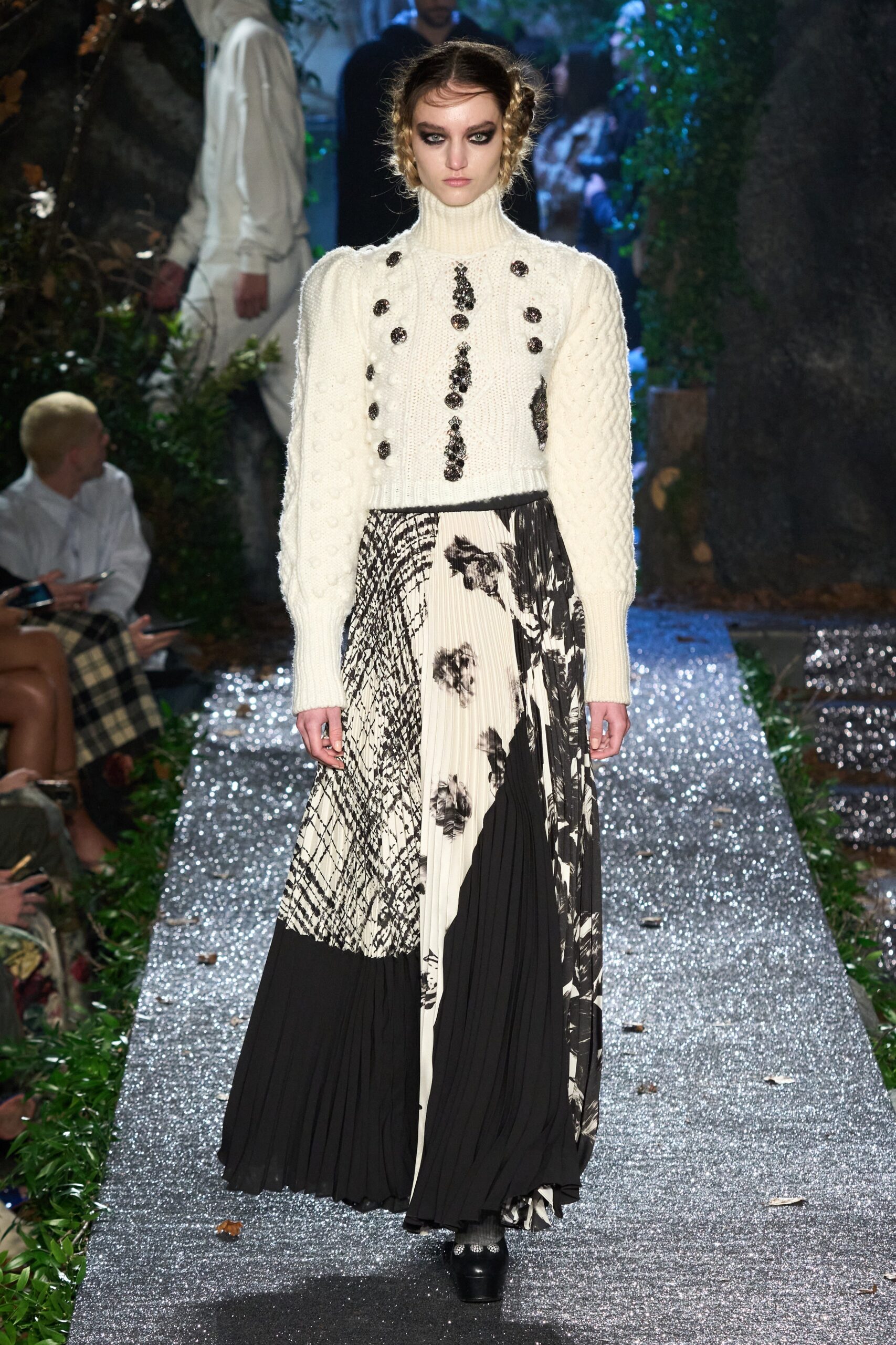 white fitted sweater and pleated skirt