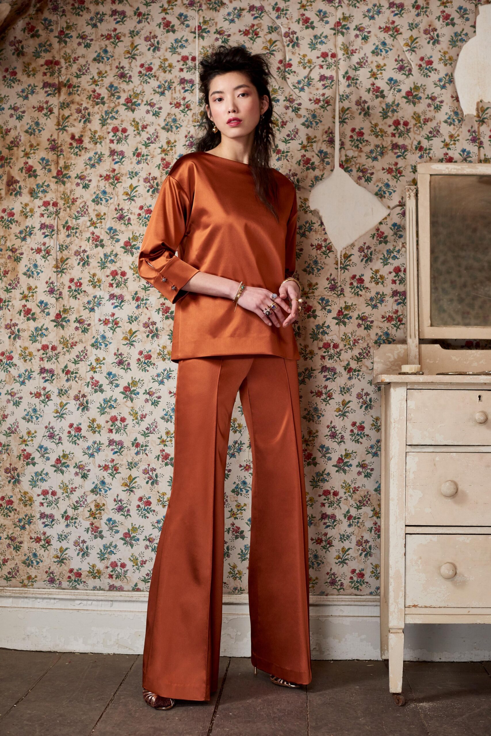 orange silk fitted flared shiny pants