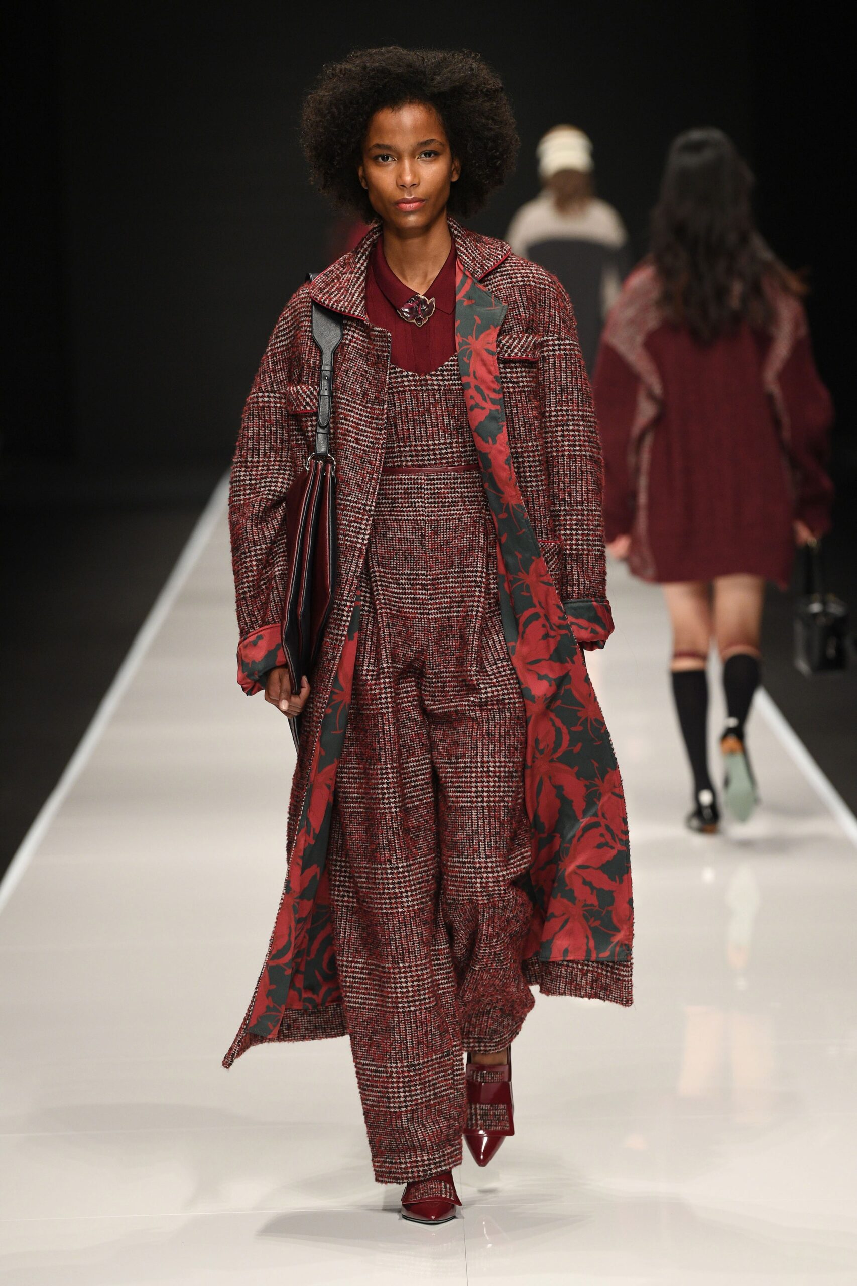 red and black wool coat with jumpsuit