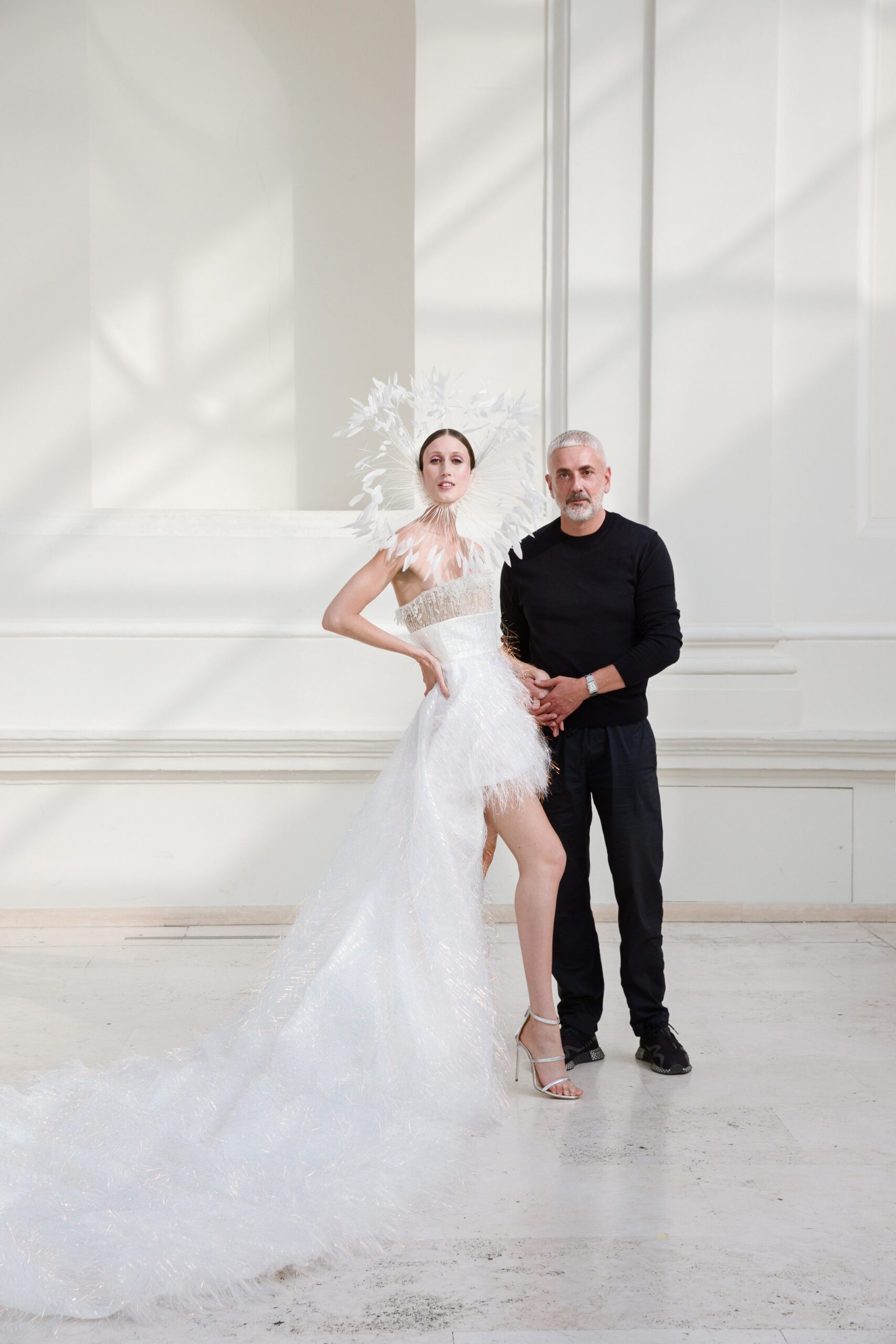 white feather embellished gown