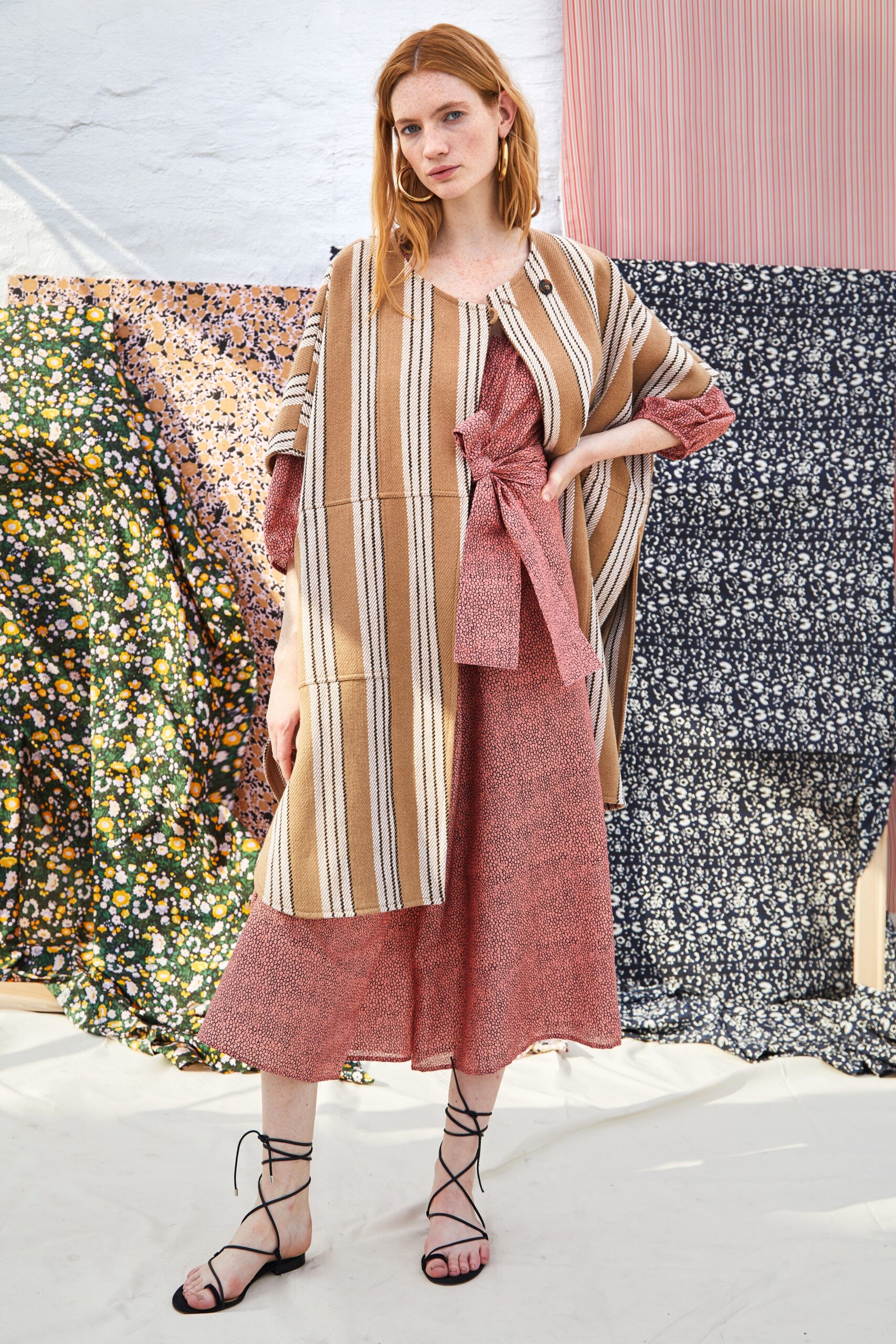 red tiered midi dress with beige striped cape
