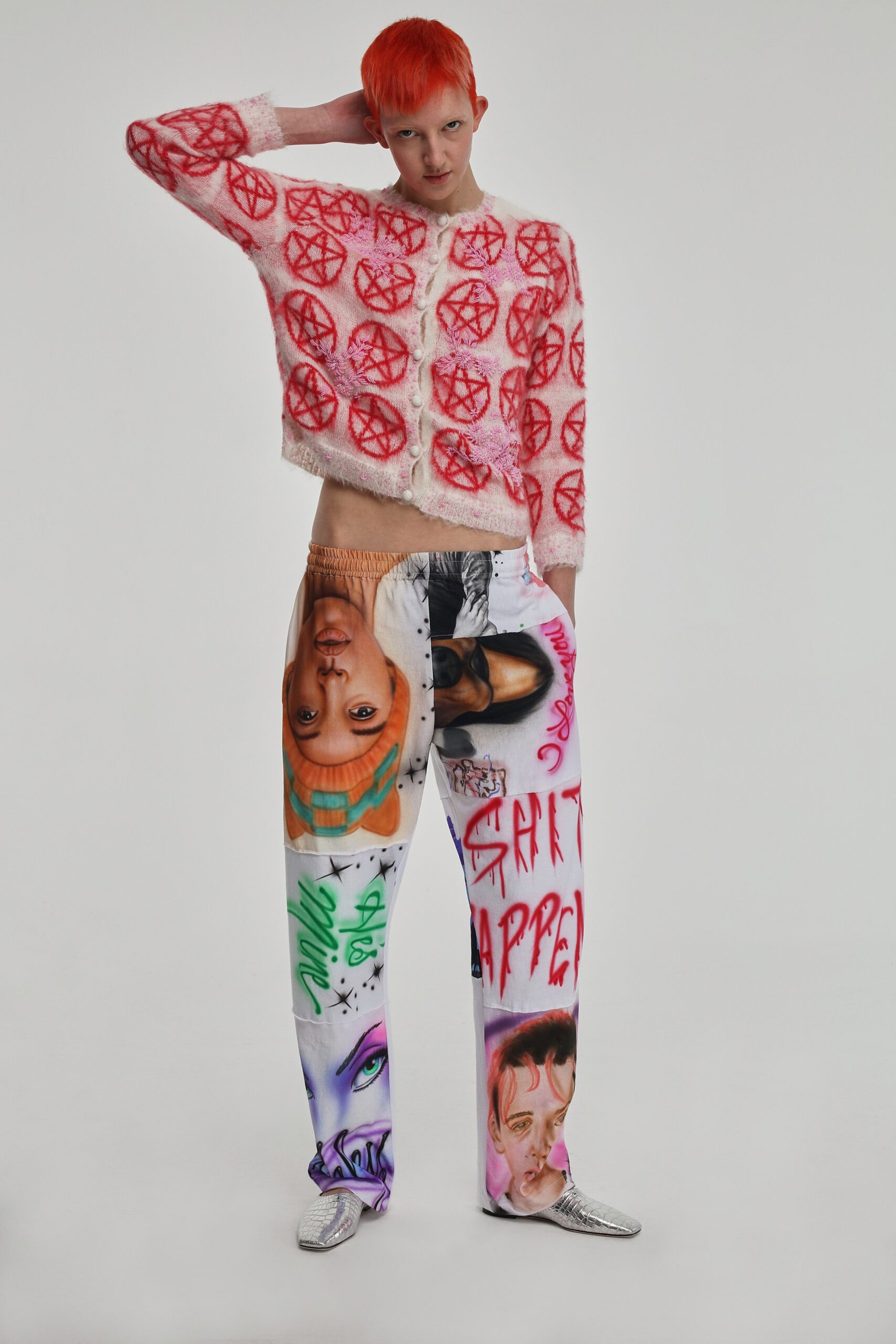 pink embroidered sweater with printed pants