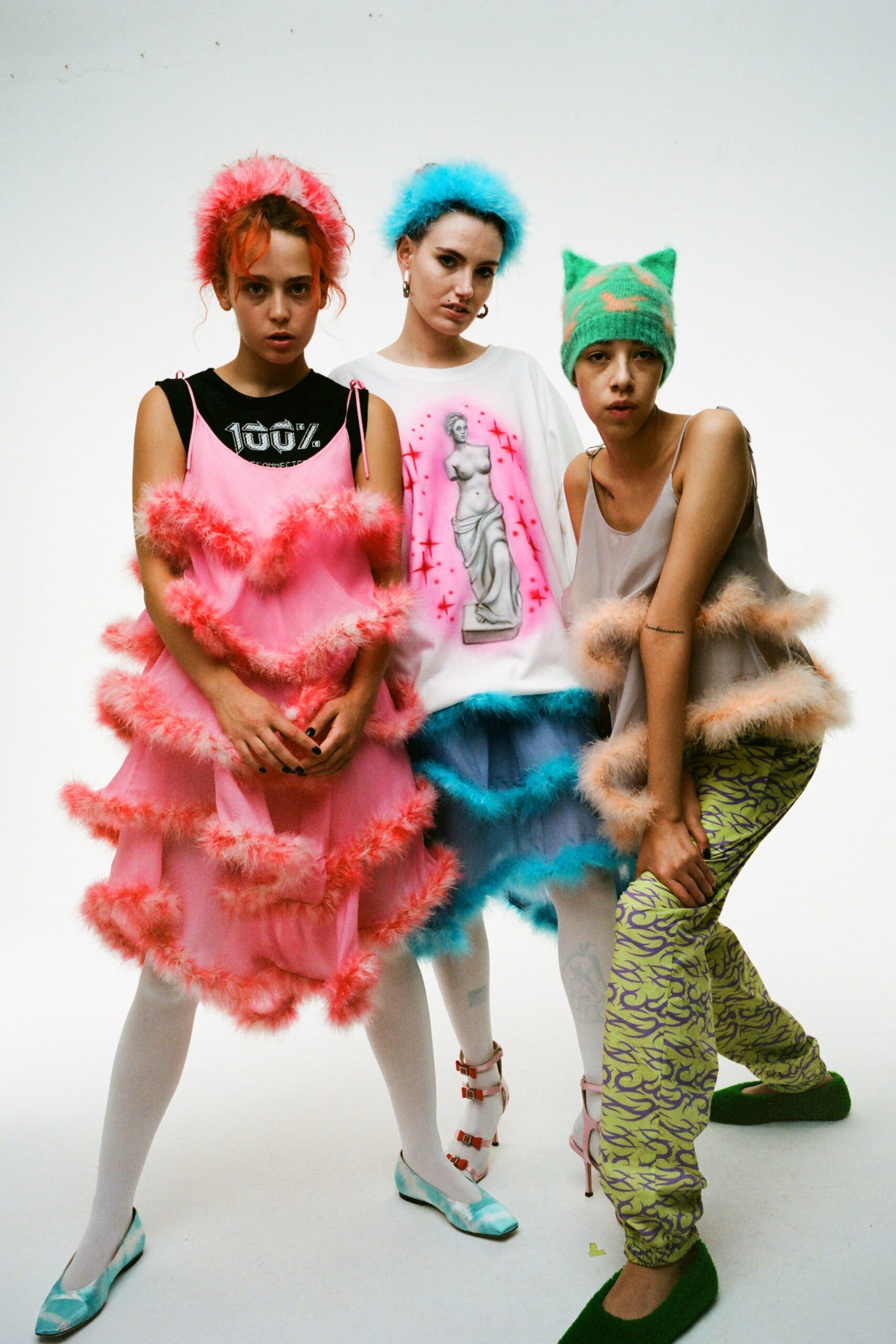 pink fringed mini dress, white printed top, green cargo pants