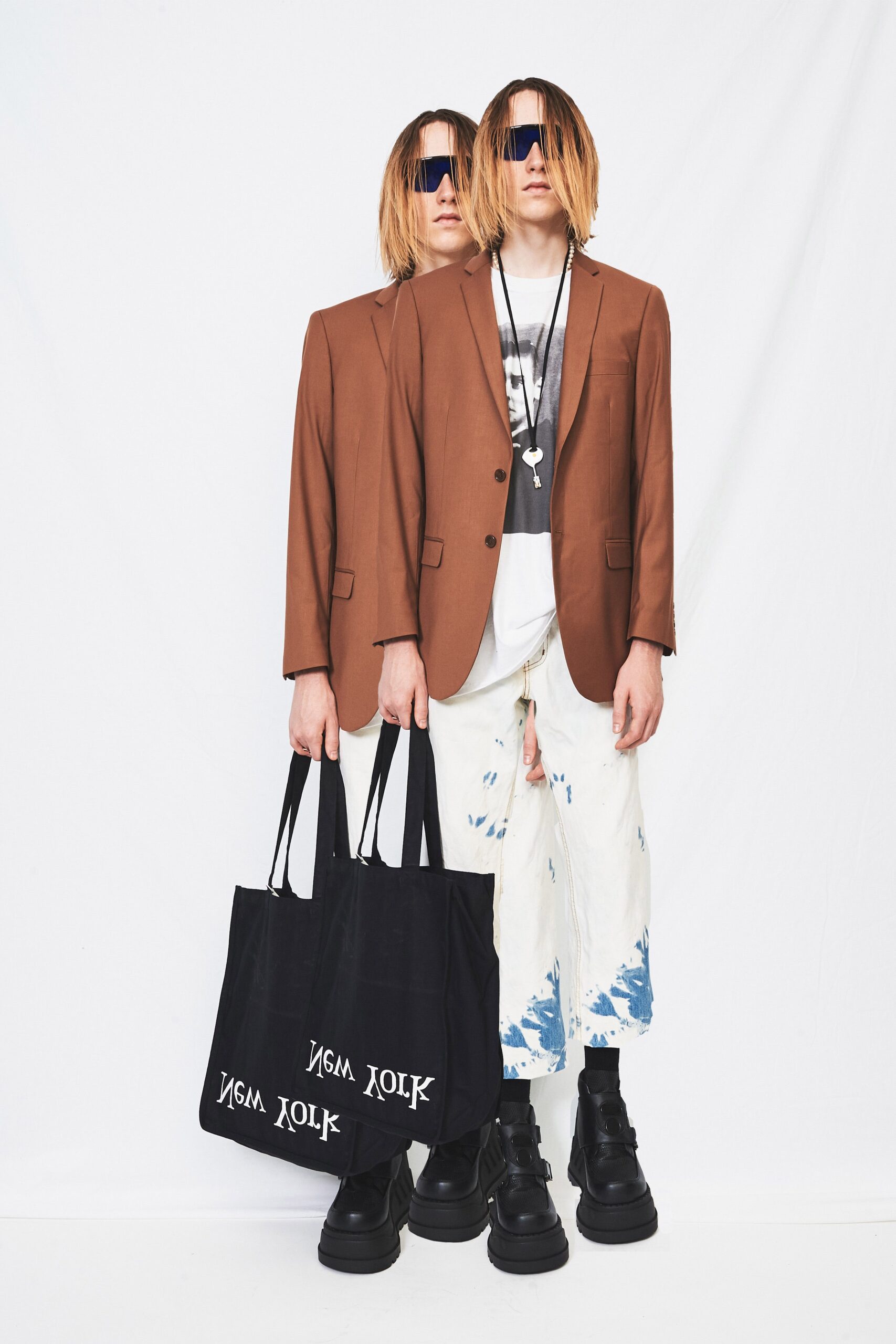 brown tailored blazer with distressed pants