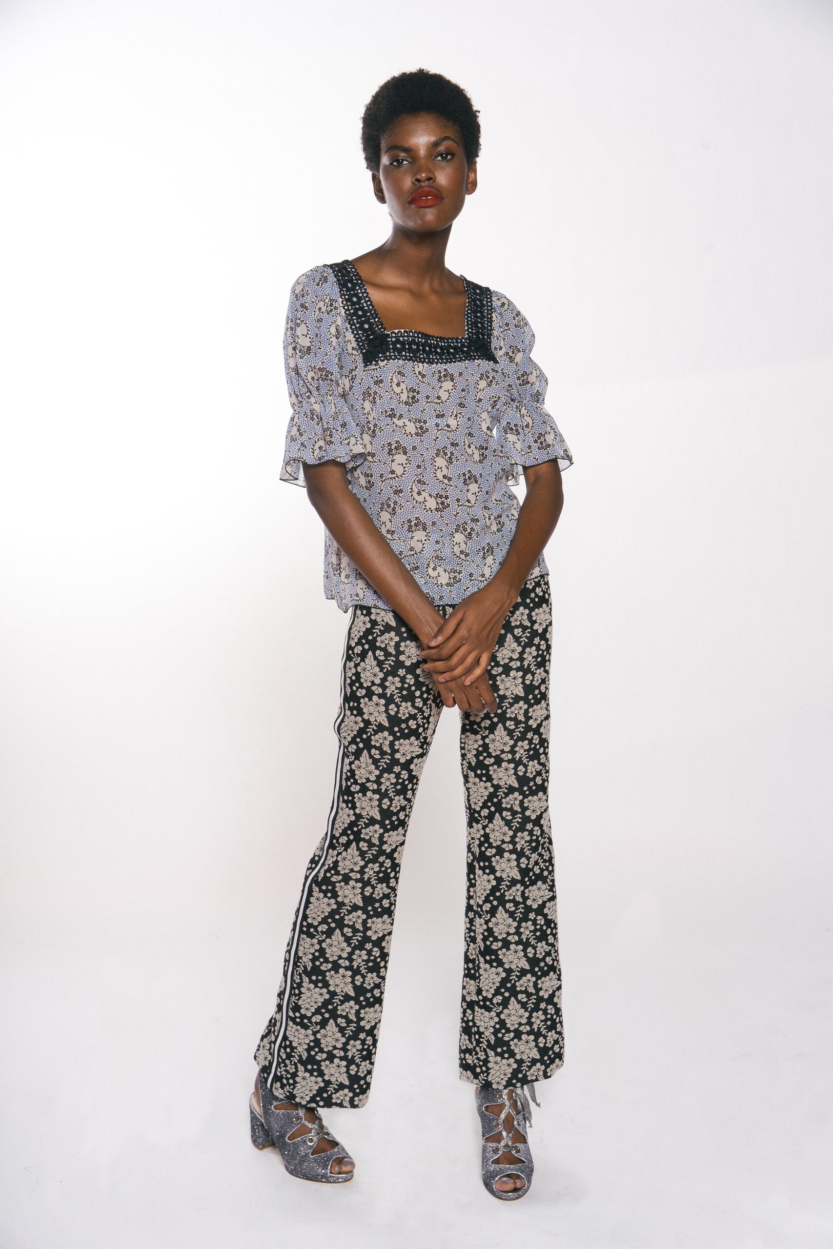 blue embroidered top with flared pants