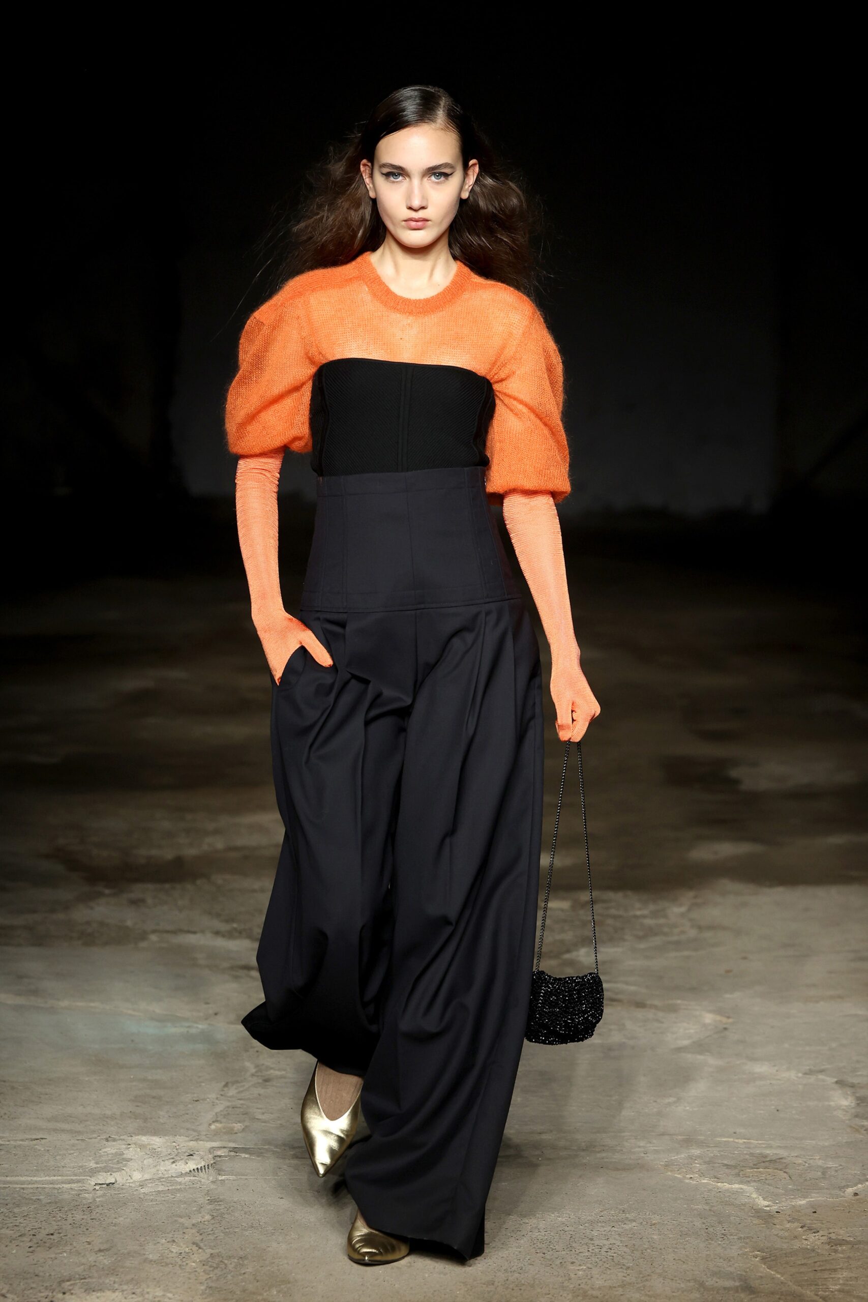 orange black fitted top and relaxed pants