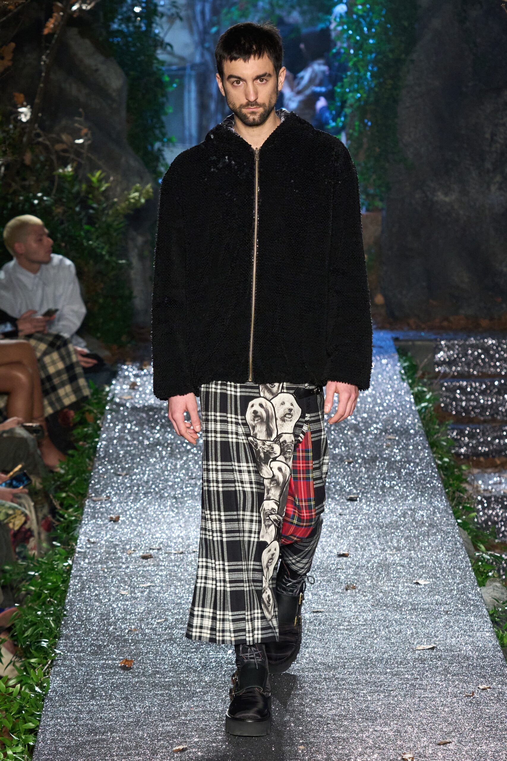 black faux-fur jacket with plaid skirt