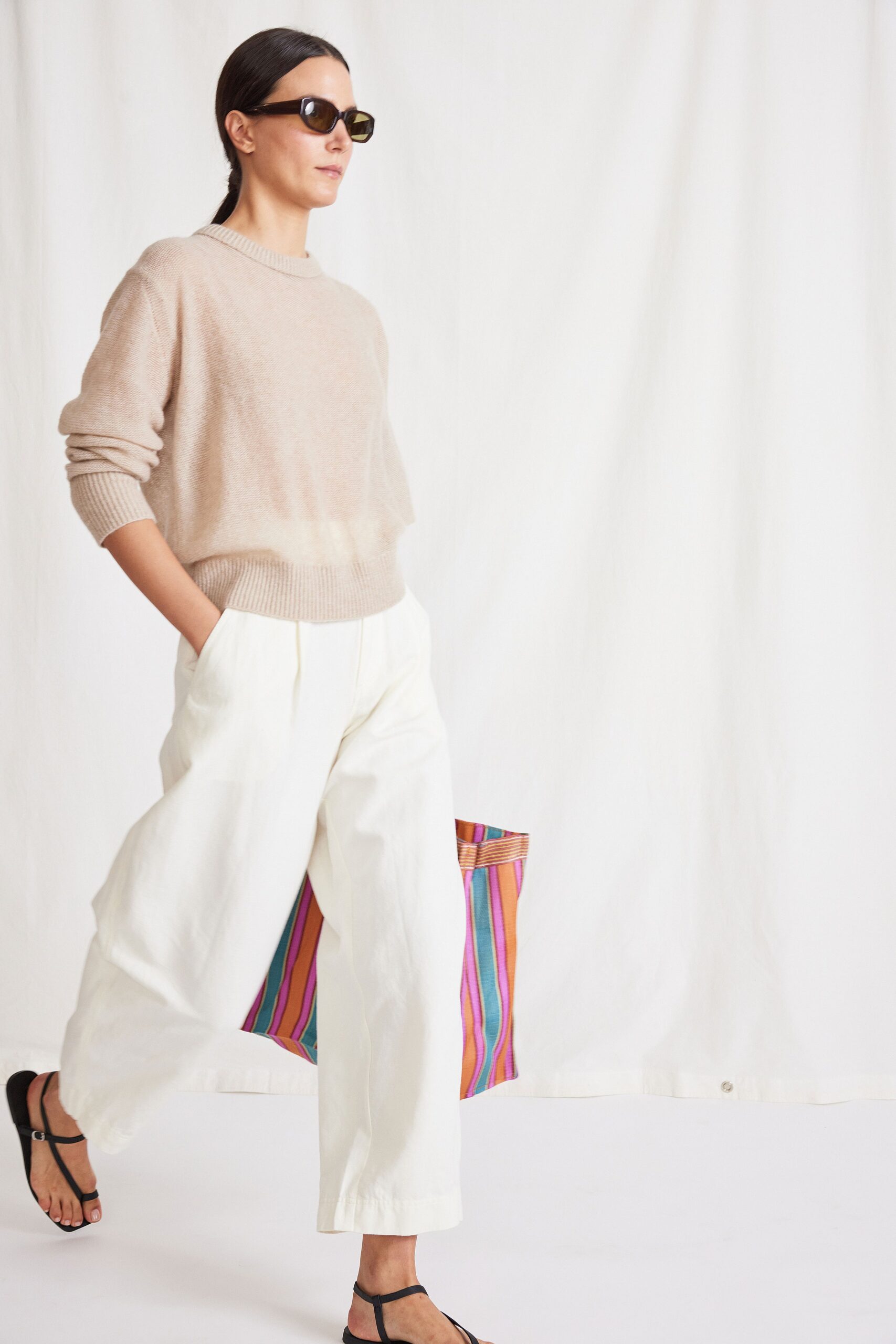 beige relaxed sweater with white pants