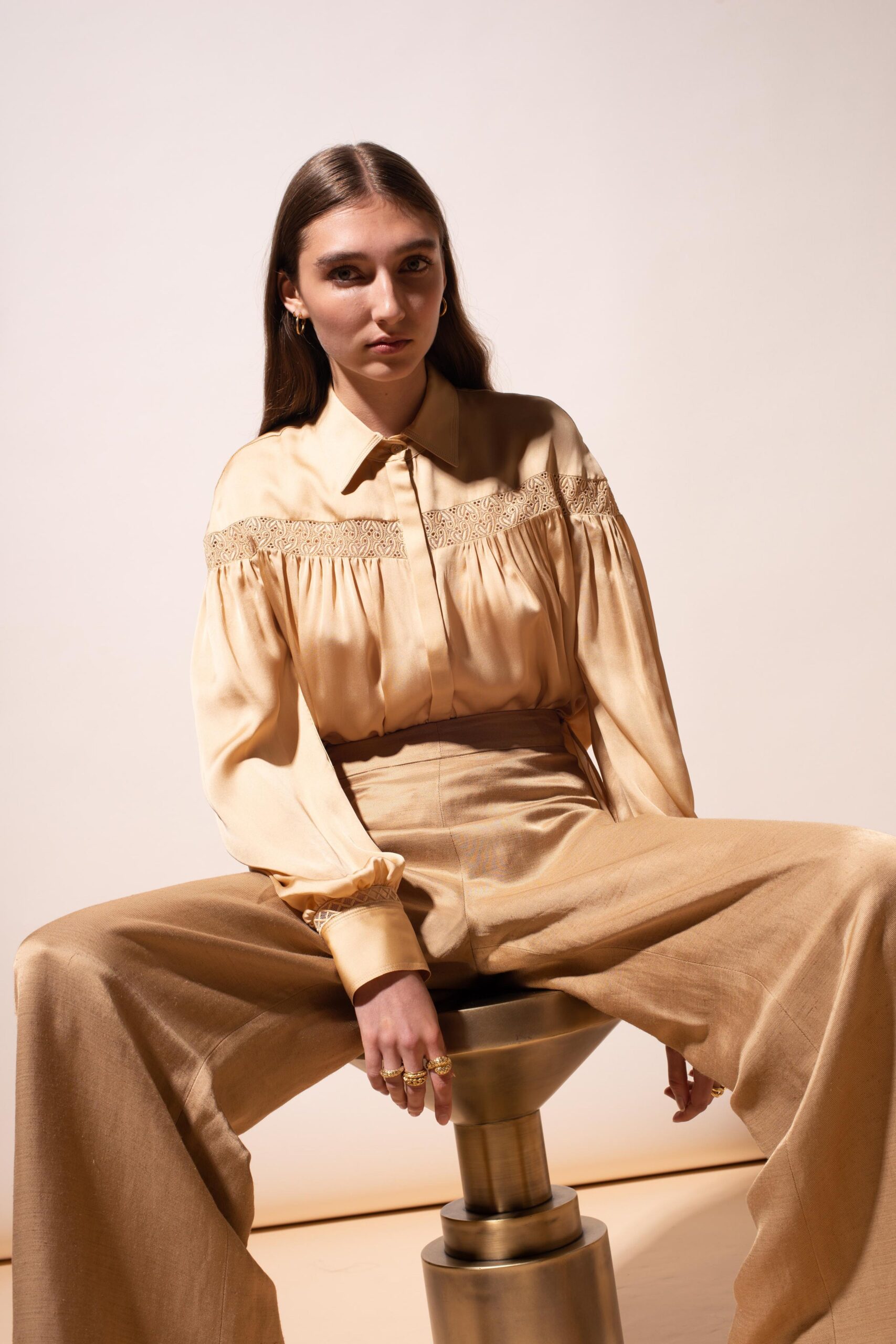 beige silk relaxed blouse and fitted pants