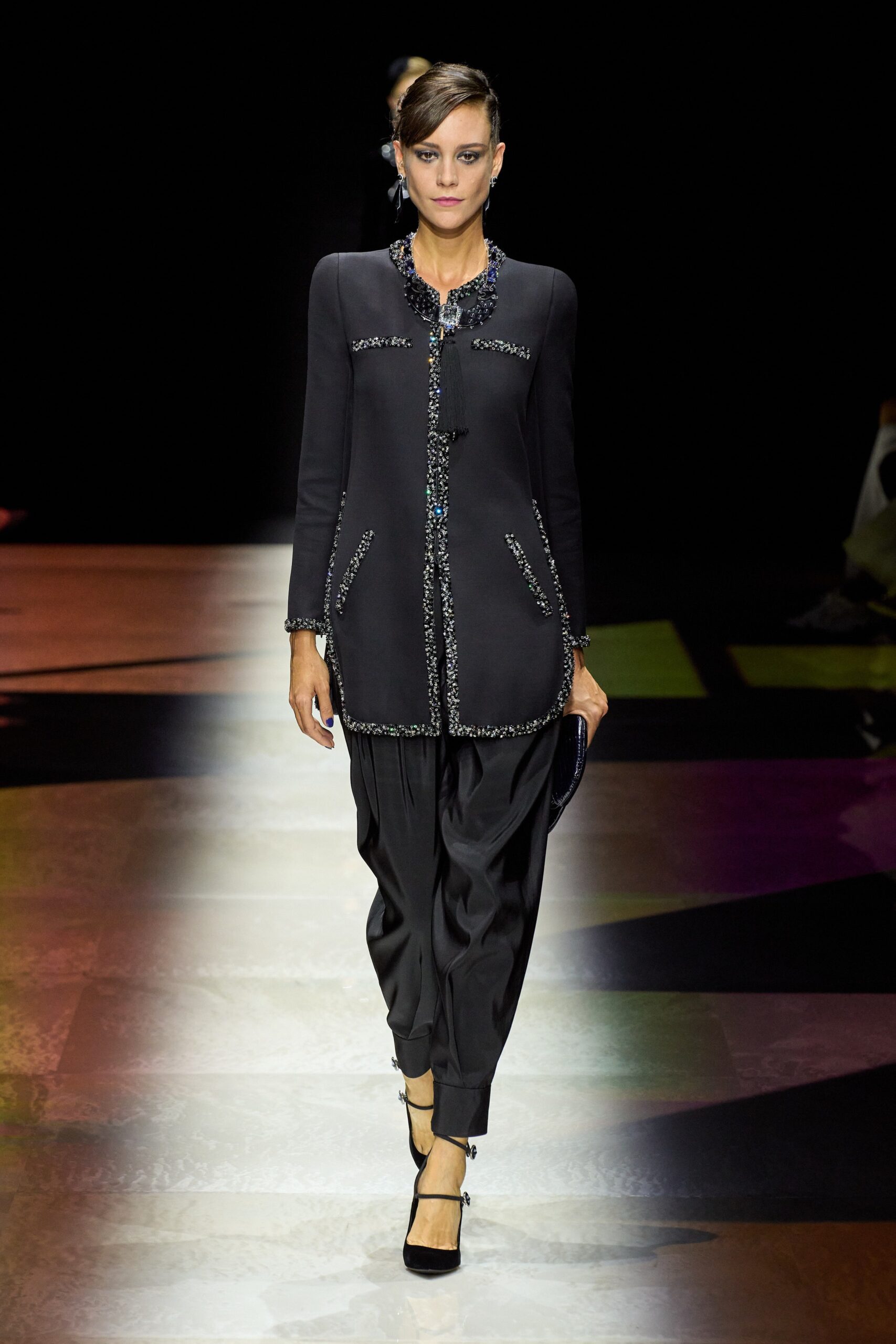 black silk fitted jacket and relaxed pants