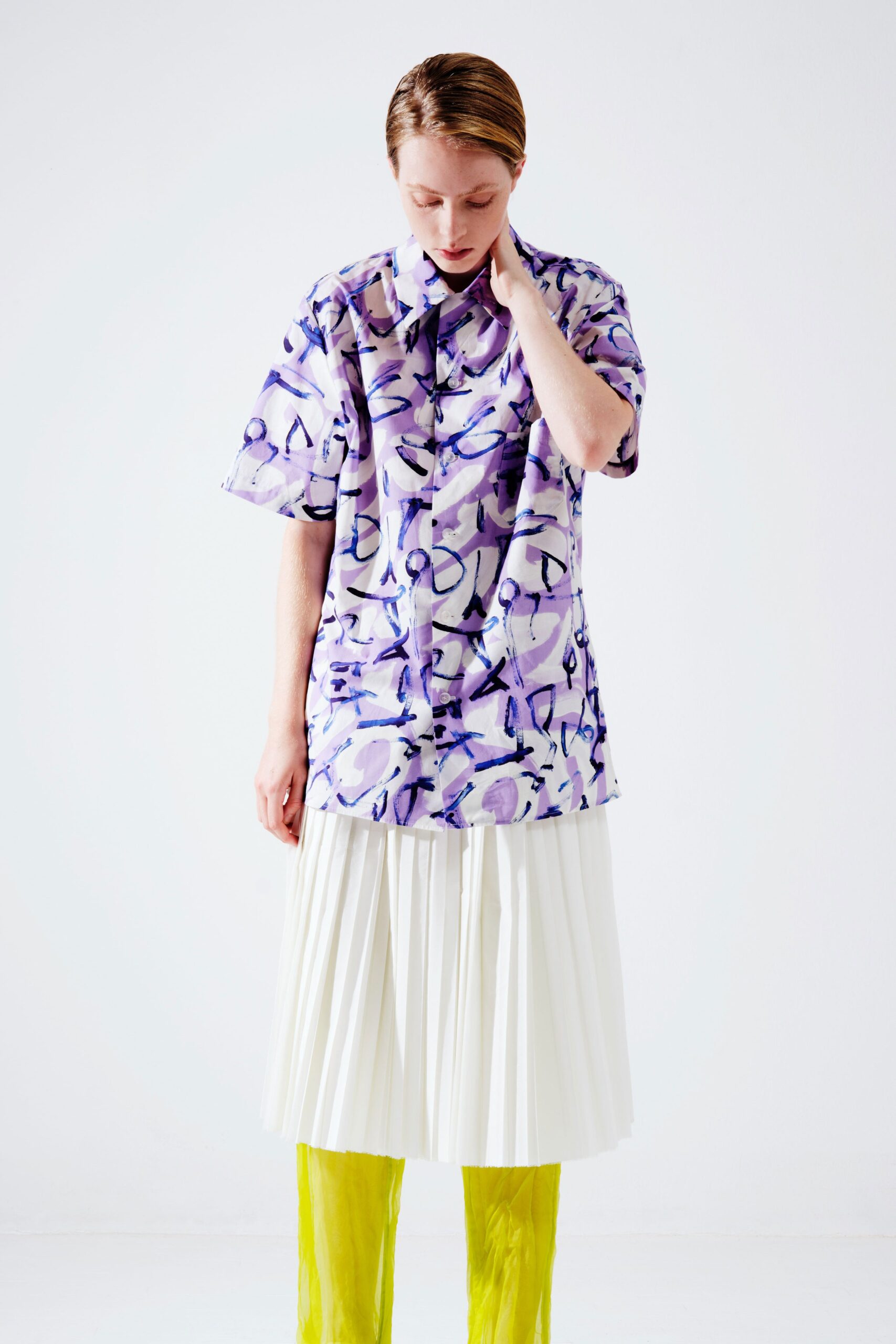 purple printed shirt with pleated skirt